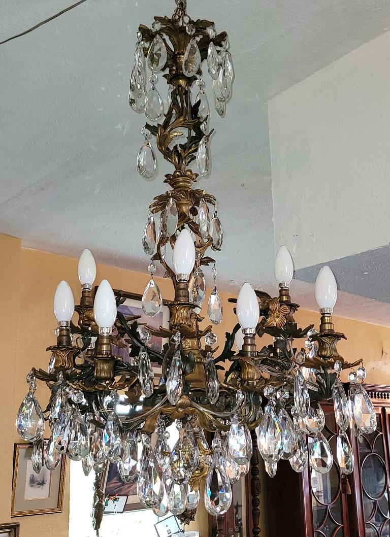 Presenting a stunning 19C French gilt metal 12 light phoenix chandelier with Swarovski crystal.

This chandelier pre-dates the advent of electricity and originally would have held candles.

Made in France circa 1860 it was converted to