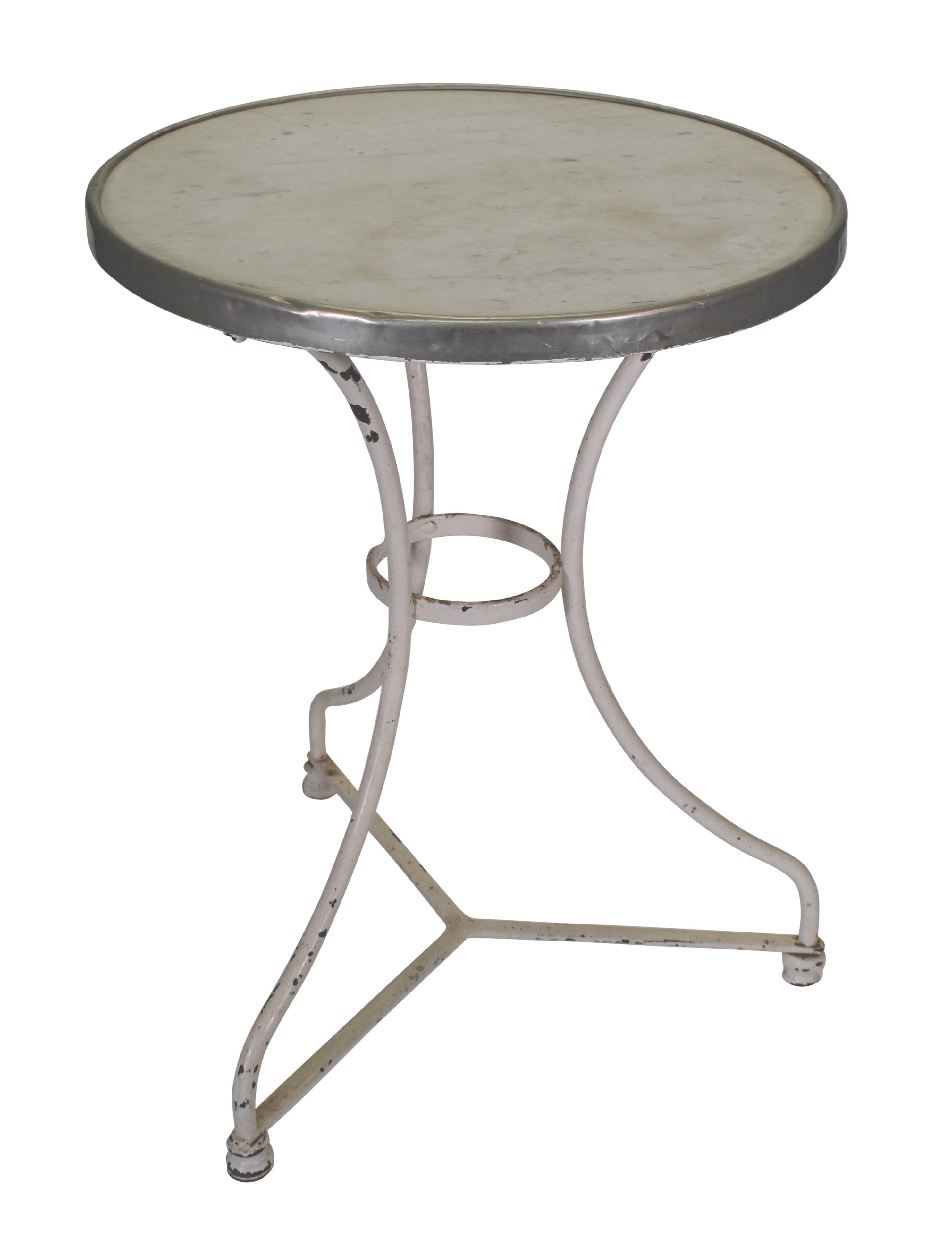 The marble top and white weathered patina on this bistro table that is perfectly sized for a side table or 2-person bistro.