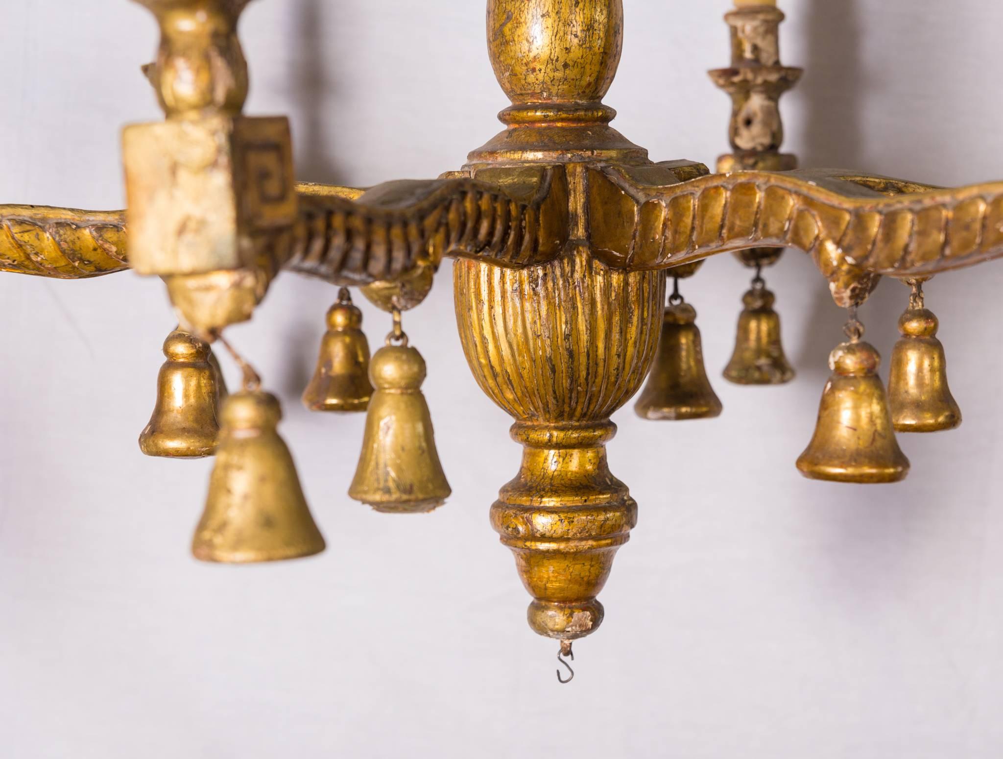 19c Italian six-armed wooden lustre. Beautiful carved chandelier with six wooden bell-shaped tassels.