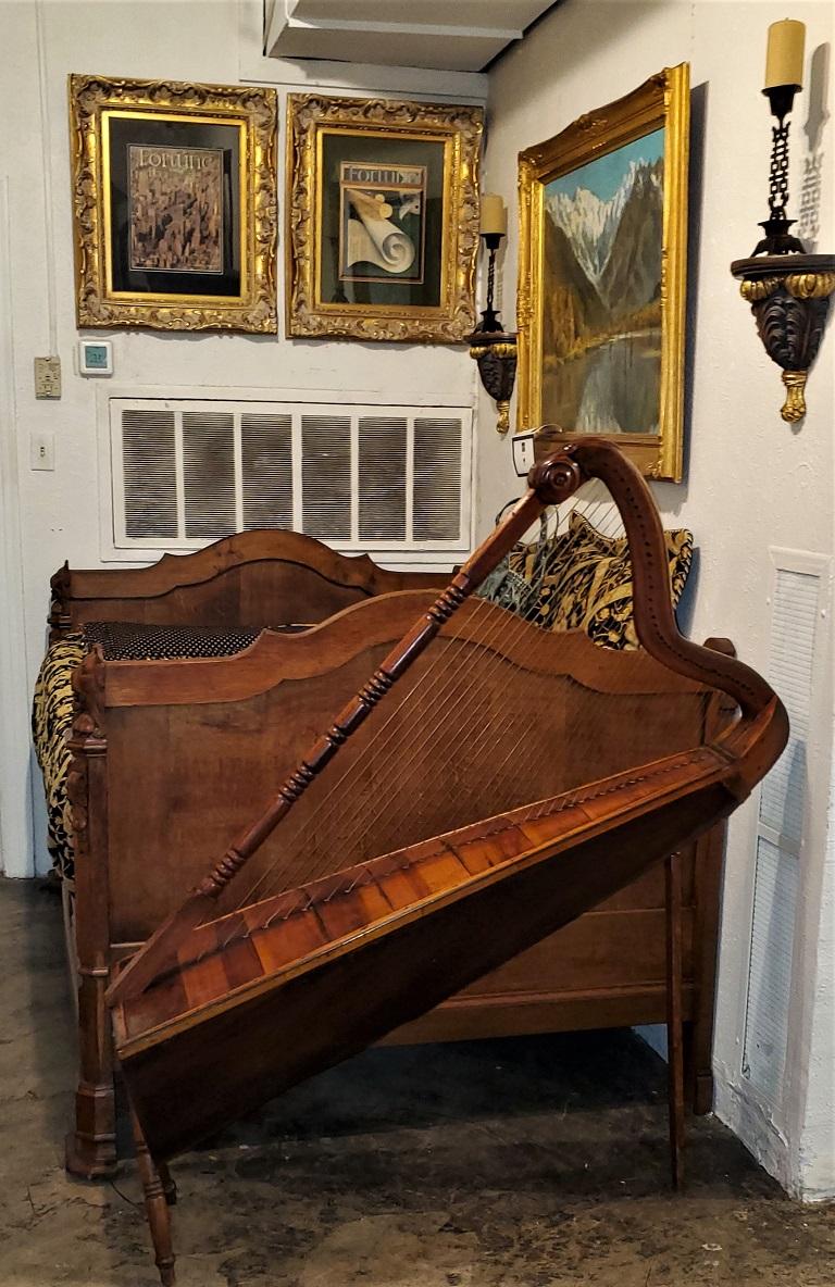 Presenting a stunning 19th century Jalisco Mexican Harp.

Made in Mexico circa 1880 of walnut and maple. This is what is commonly referred to as a Jalisco Harp (see history later in the post).

It is in good working condition but could probably