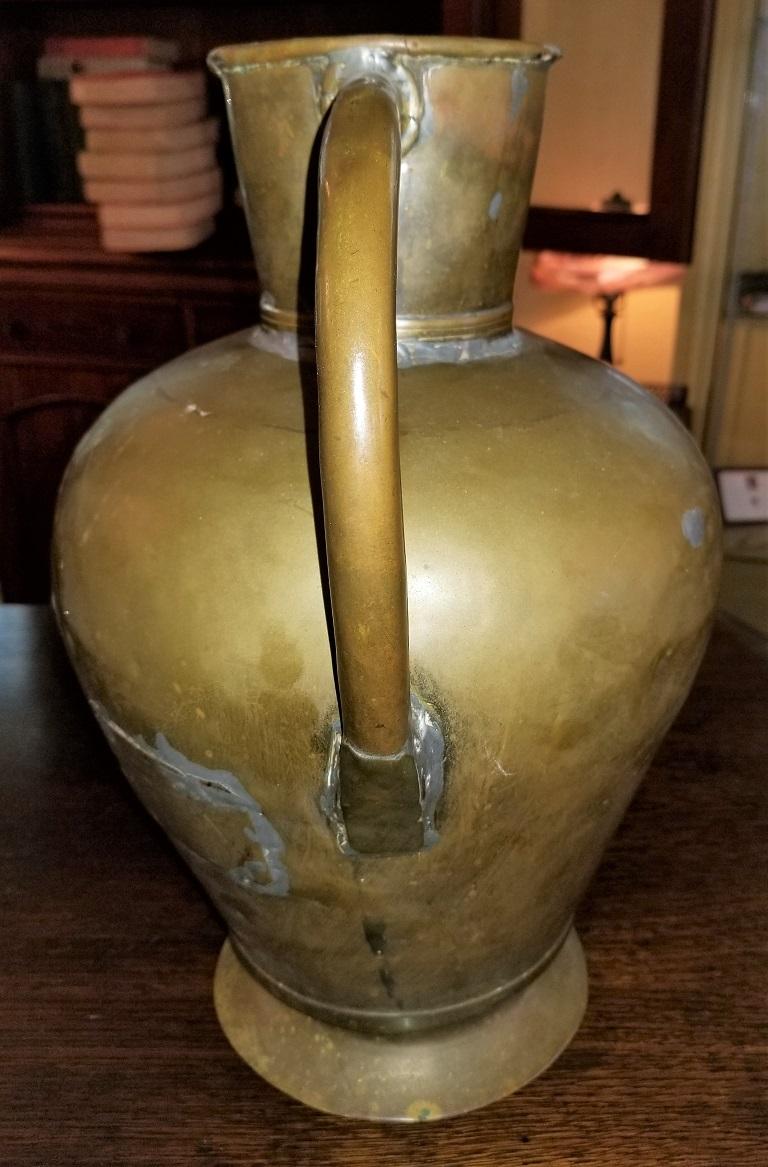 Presenting a fabulous historic treasure of times past, namely, a 19th century large Civil War Era bronze and tin pitcher.

From circa 1850, this is an American frontier piece.

It appears to be made of bronzed tin with brass and copper