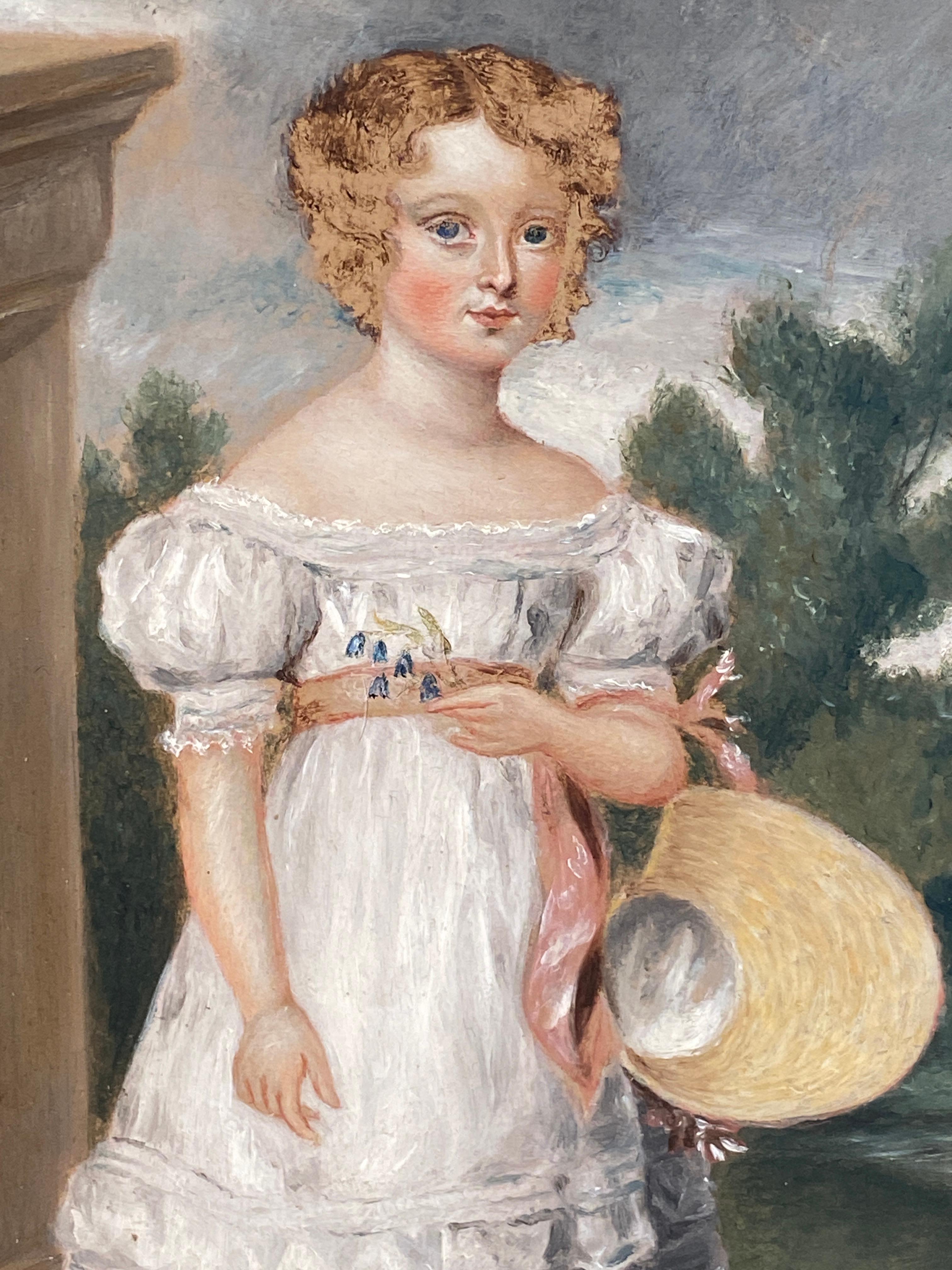  A 19c naive oil painting on a thin wooden panel of a young girl in an architectural and wooded landscape in a black painted frame with gilt slip. A regency period portrait of a girl holding her bonnet and freshly plucked flowers in a silk dress and