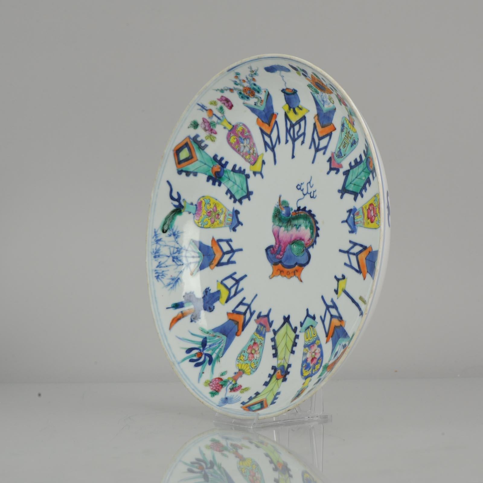 A fine and rare Chinese porcelain plate, made during the 19th century. To the centre a Foo dog on standing on some kind of Bench. The outer scene are flower basket. Underglaze blue and overglaze other colors.

Kangxi marked at base.

 

 A