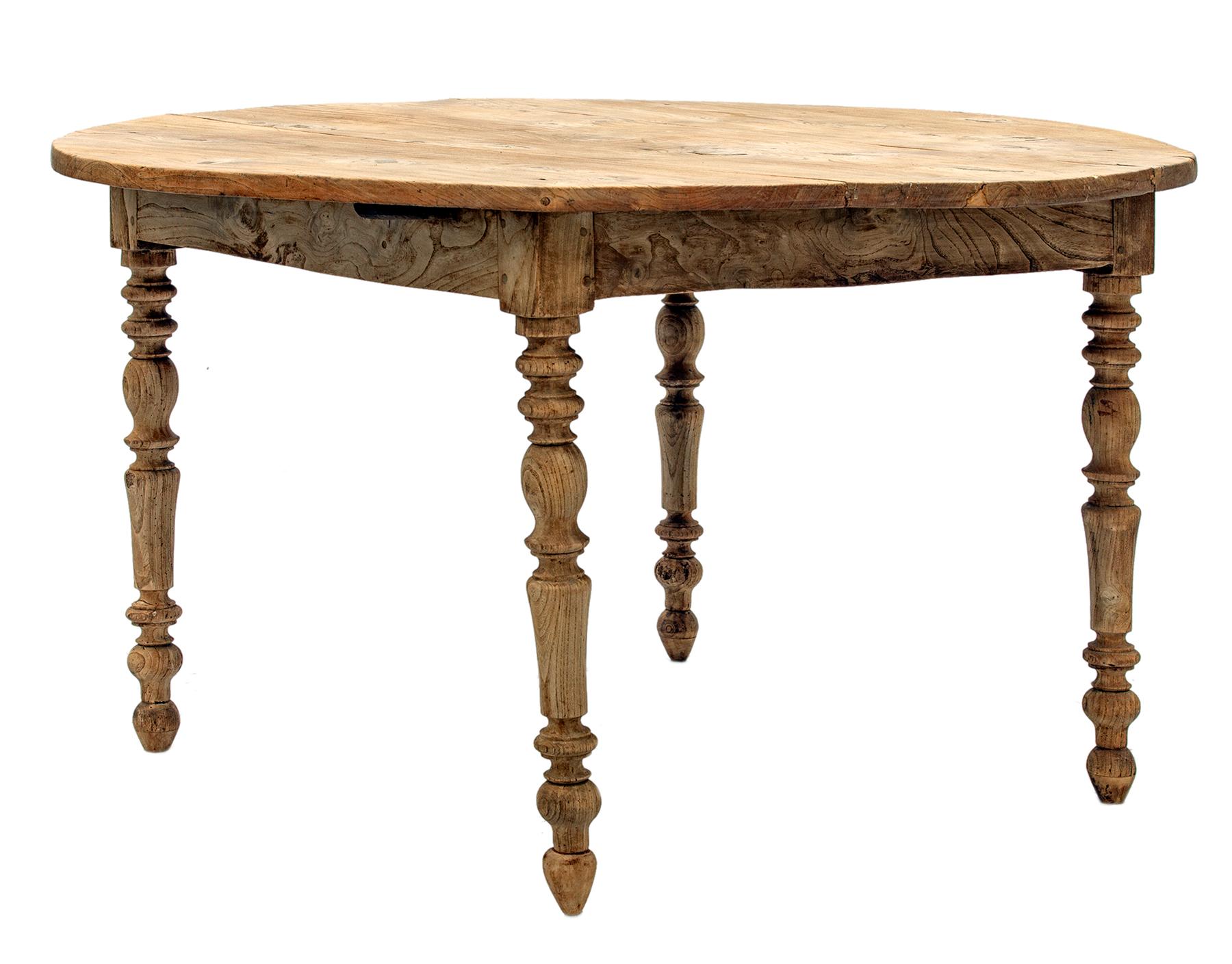 Late 18th Century European round table with a blonde patina.
This table has lots of warmth and visible history. The table is completely handcrafted, using handmade wooden pegs & & joints.
The tabletop is constructed with three panels which have rich