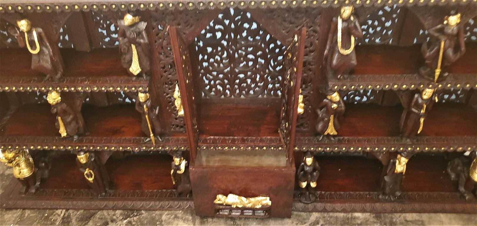 PRESENTING an EXCEPTIONAL AND RARE 19C SE Asian Highly Carved Wooden and Gilded Floor or Wall Case or cabinet featuring Hindu Gods.

OUTSTANDING and VERY RARE!

Mid 19th Century, circa 1850 and probably Cambodian, Thai or Burmese, carved rosewood