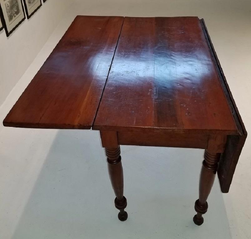 PRESENTING a VERY RARE Early19th Century Cherrywood Drop Leaf Table with Civil War Provenance.

Made, most likely, in the Ohio River Valley area, probably in West Virginia or Northern Kentucky, given it’s Provenance, circa 1820-25.

This table is in