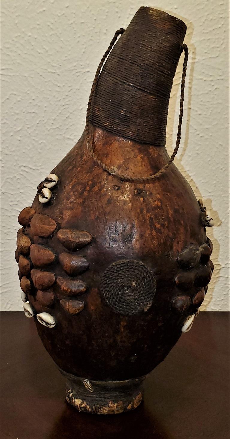 Presenting a gorgeous piece of African Tribal art, namely, a vintage West African Gourd.

Probably made in either The Congo or Cameroon, mid-20th century.

Appears to be made from some kind of nutshell or husk ….. probably a Calabash, with