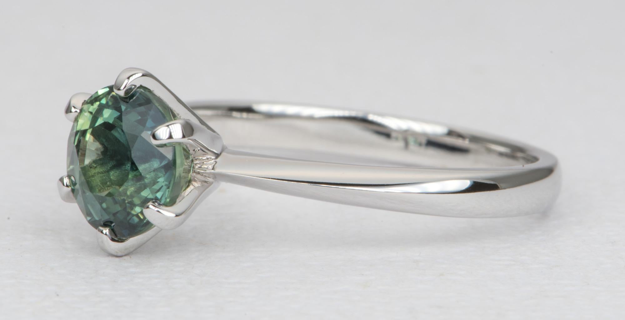 ♥  Solid 14K white gold ring set with a stunning blue green sapphire!
♥  The stone is securely set in a 6-prong setting, with a knife edge shank to further accentuate the beautiful center stone

♥  Ring Size: 6.25 (Free resizing)
♥  Band width: