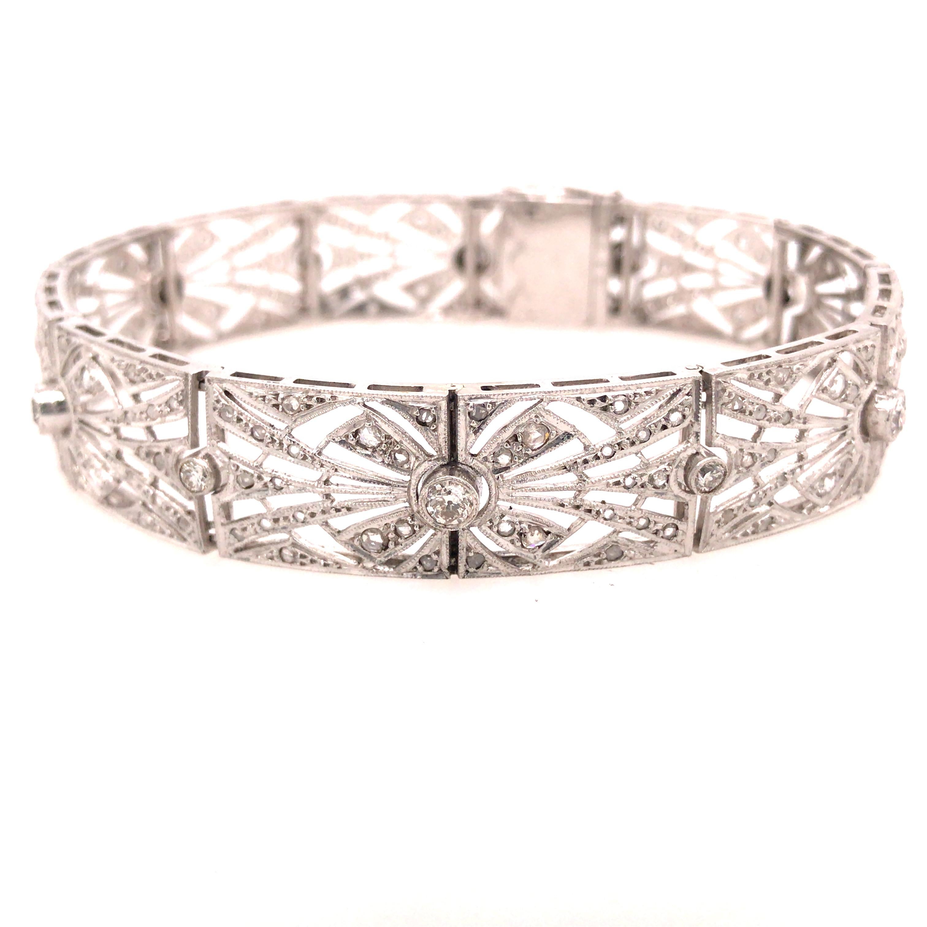 19K Art Deco French Bracelet White Gold.  Round Brilliant Cut Diamonds weighing 2.12 carat total weight G-H in color and VS-I1 in color are expertly set.  The Bracelet measures 7 1/2 inch in length and 1/2 inch in width.  29.70 grams.  Serial Number