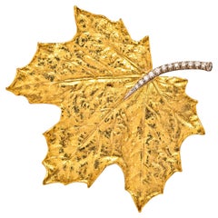 Broche feuille en or 19k et diamant