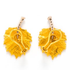 Boucles d'oreilles feuilles en or 19k et diamants