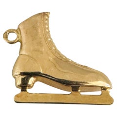Charm in oro giallo portoghese 19k da 1,2 g con pattini da ghiaccio