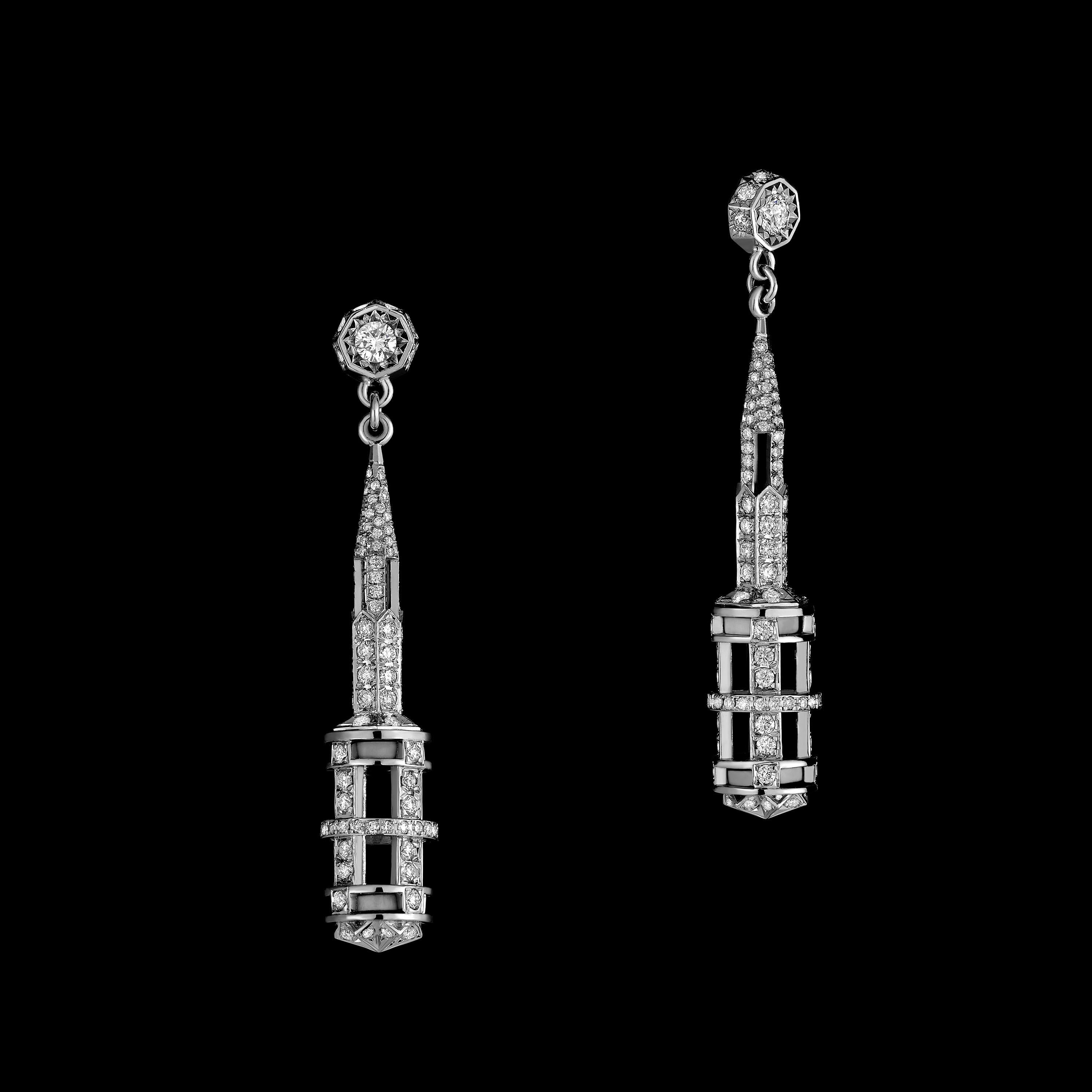 Architectural earrings in 19K gold and platinum, set with diamonds and fossilized mammoth ivory. Elegant example of high end designer creation.

Tender sensitivity of the feminine and the architectural strength of the masculine. Inspired by Ulmer