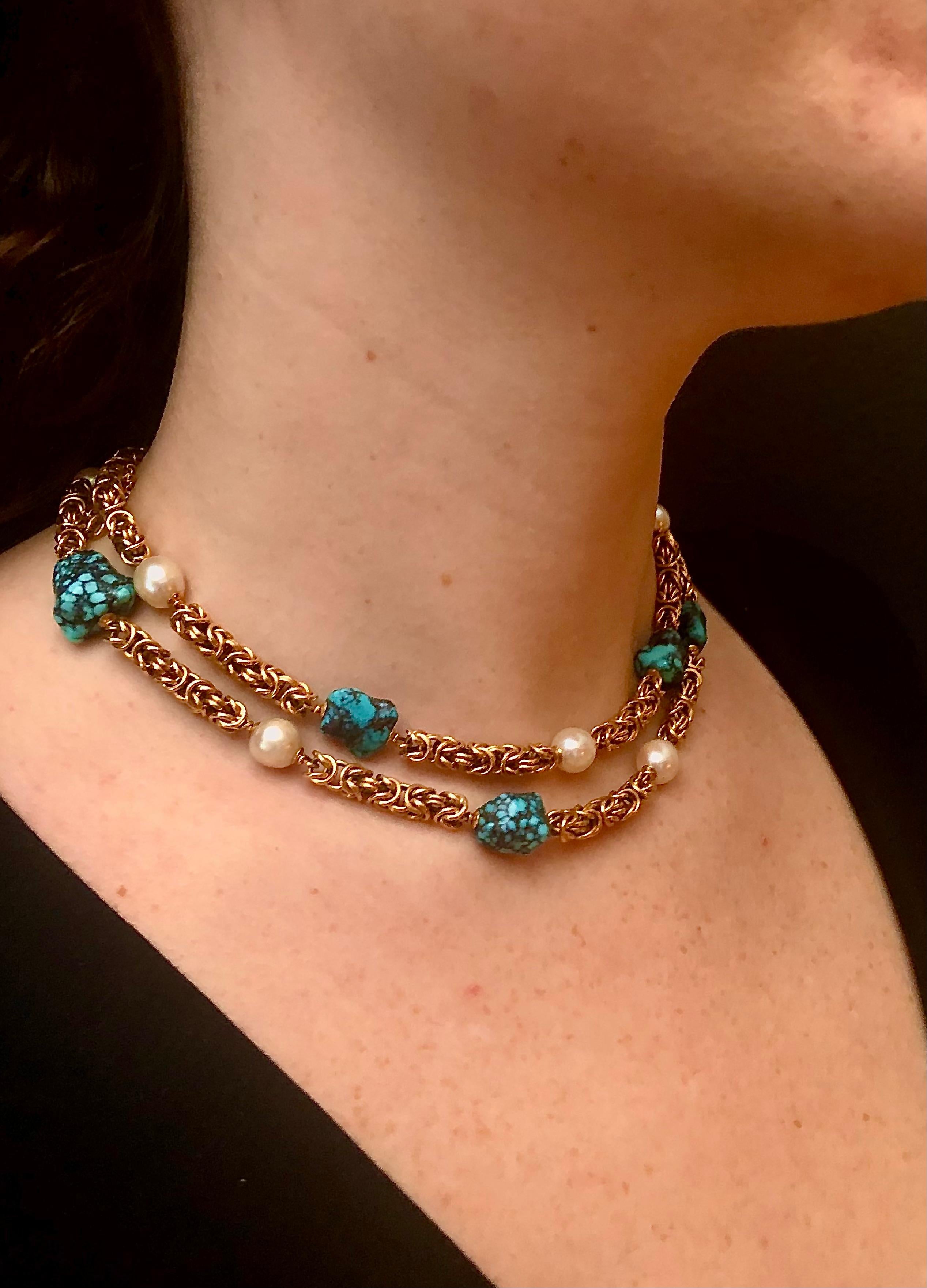 Heavy, spectacular gold Byzantine complex chain in 19.02 high kt gold interspersed with creamy white oval cultured pearls and turquoise nuggets.

The pearls have very faint blue/gold overtones and are a high luster. Pearls measure approximately 9mm