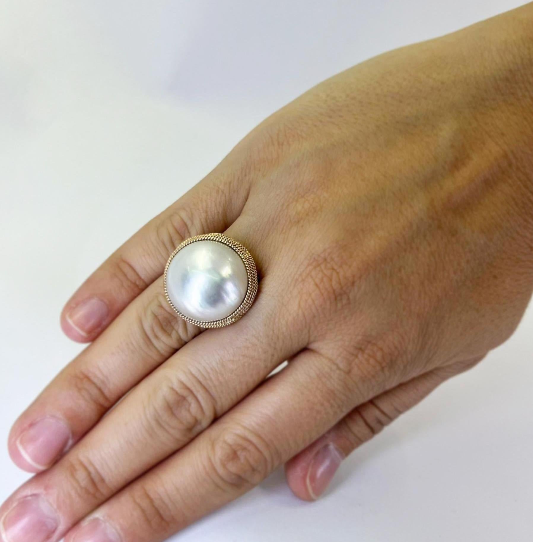 14 Karat Rose Gold 19mm Round Mabe Pearl Ring Featuring Rope Texture Details. Finger Size 7. Includes One Sizing Service Upon Request, Prior to Shipping. Finished Weight Is 10.3 Grams.