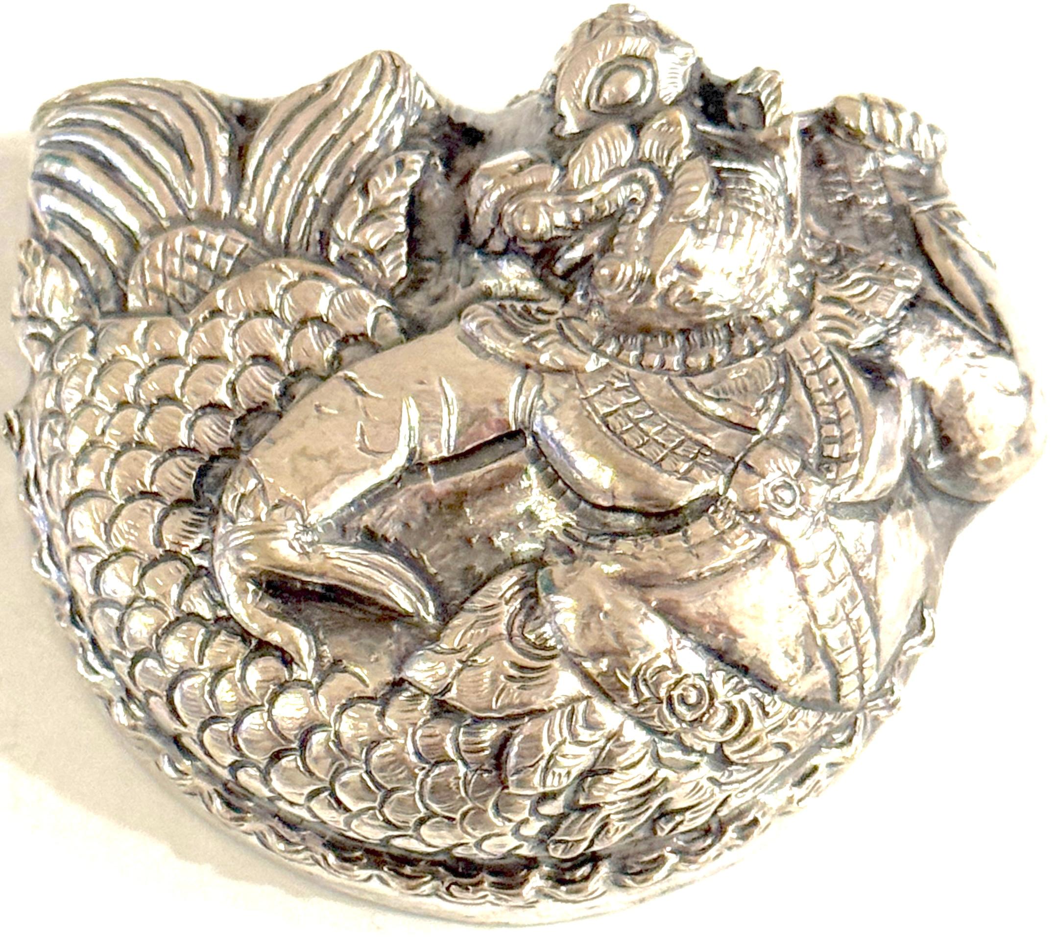 Repoussé Silver Box with Mythical Guardian Figure, Tibet or South India
Late 19th–Early 20th Century 
Two pieces, the top and bottom, fit securely for a total weight of 58 grams. 

A striking and intricately detailed silver box featuring a