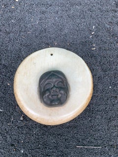 19th-20th Century Alaskan Bronze Face on Round Whale Bone Plaque