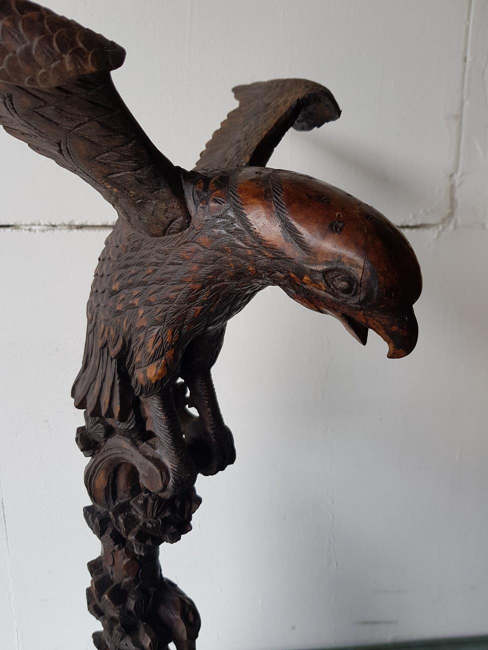 Old Asian wooden sculpture of an eagle standing on a tree trunk with vegetation (restoration of head and wings), 19th-20th century.

The measurements are,
Depth 24 cm/ 9.4 inch.
Width 37.5 cm/ 14.7 inch.
Height 64.5 cm/ 25.3 inch.
     