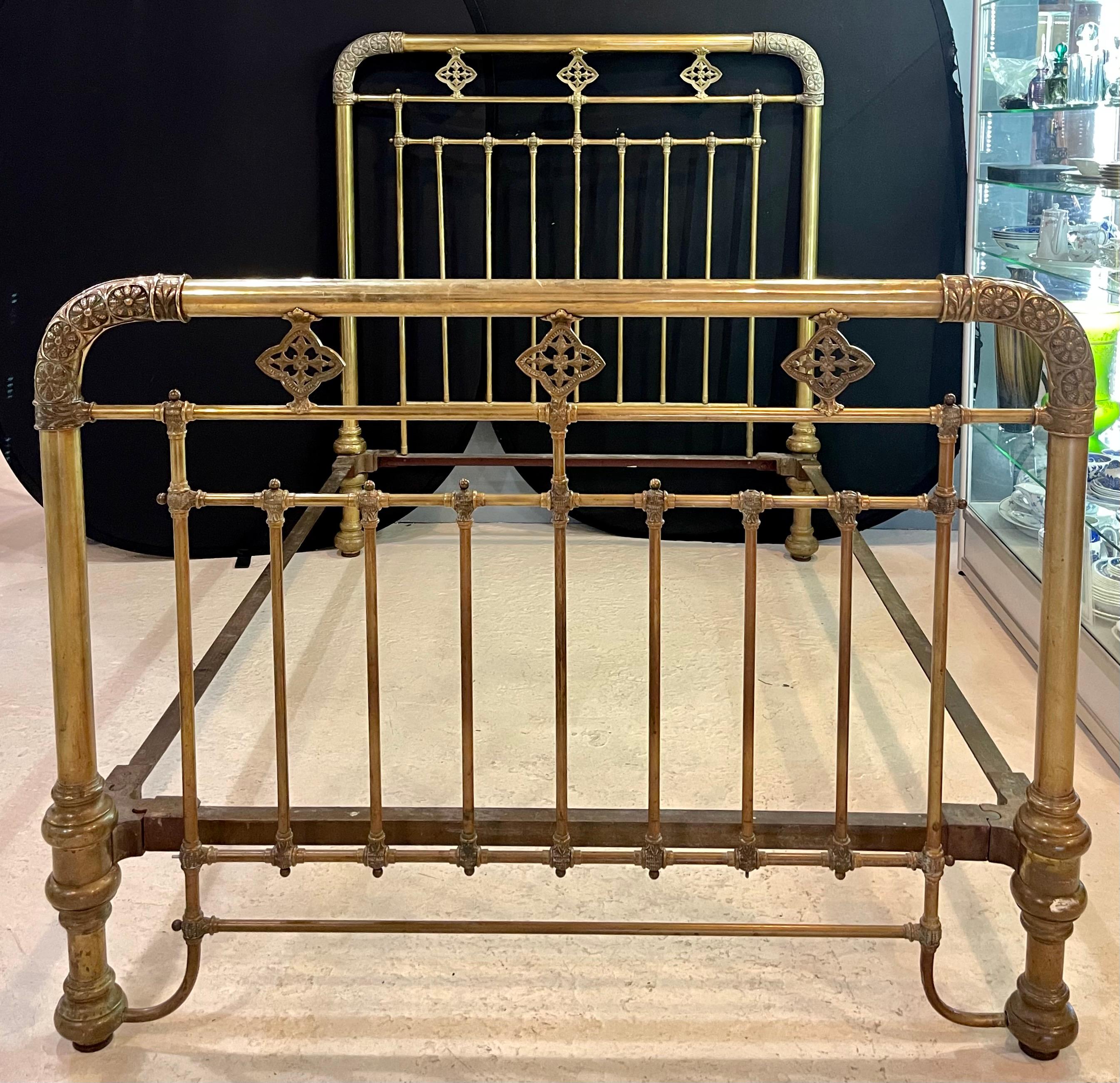 19th-20th century brass bed frame. Full sized early 20th century frame that is strong and sturdy with all the earmarking of fine casting. This wonderfully column decorated frame has detailed corner turns as well as a detailed apron. The frame itself
