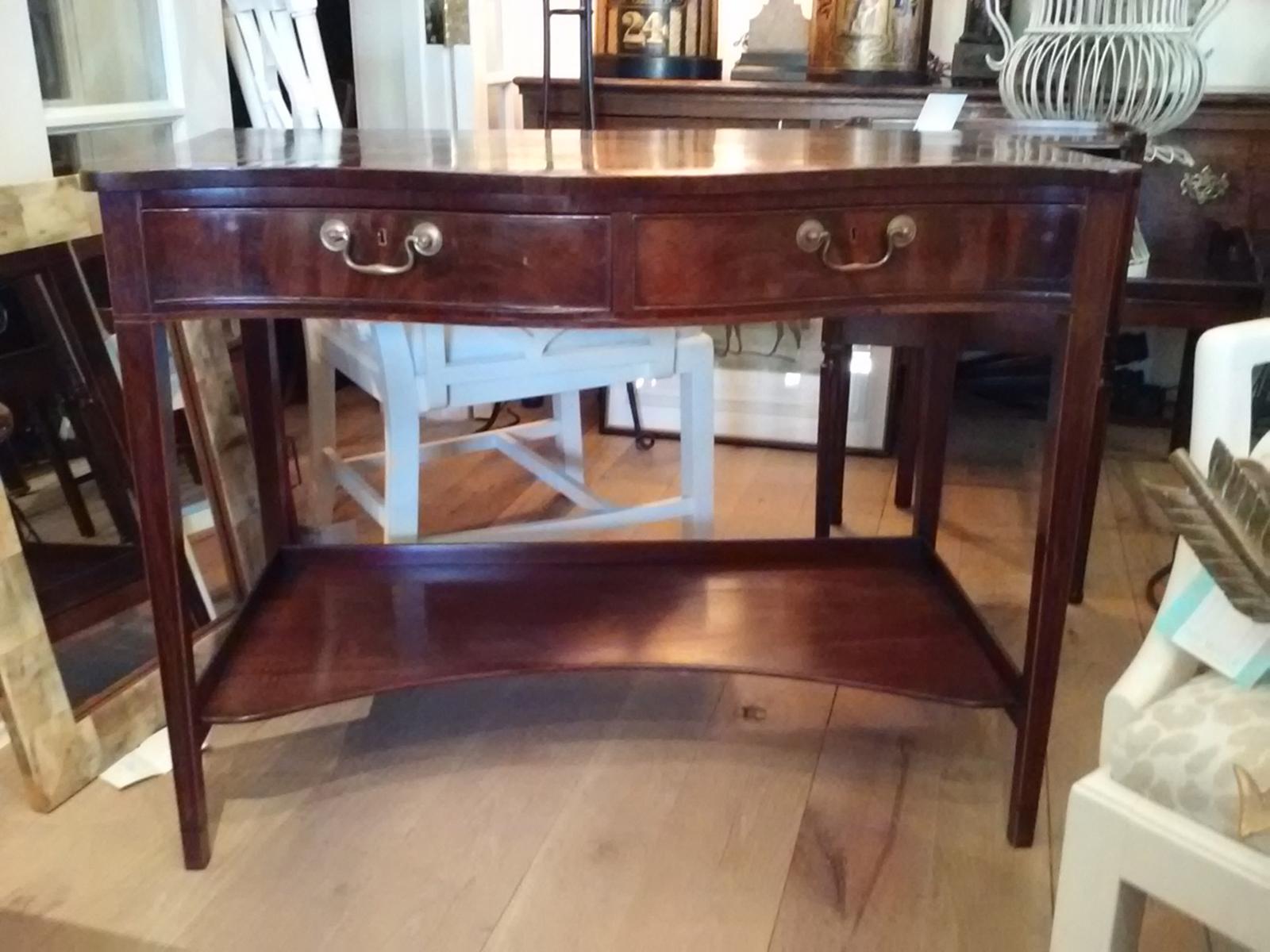 19th-20th century English Georgian style mahogany server with two drawers.