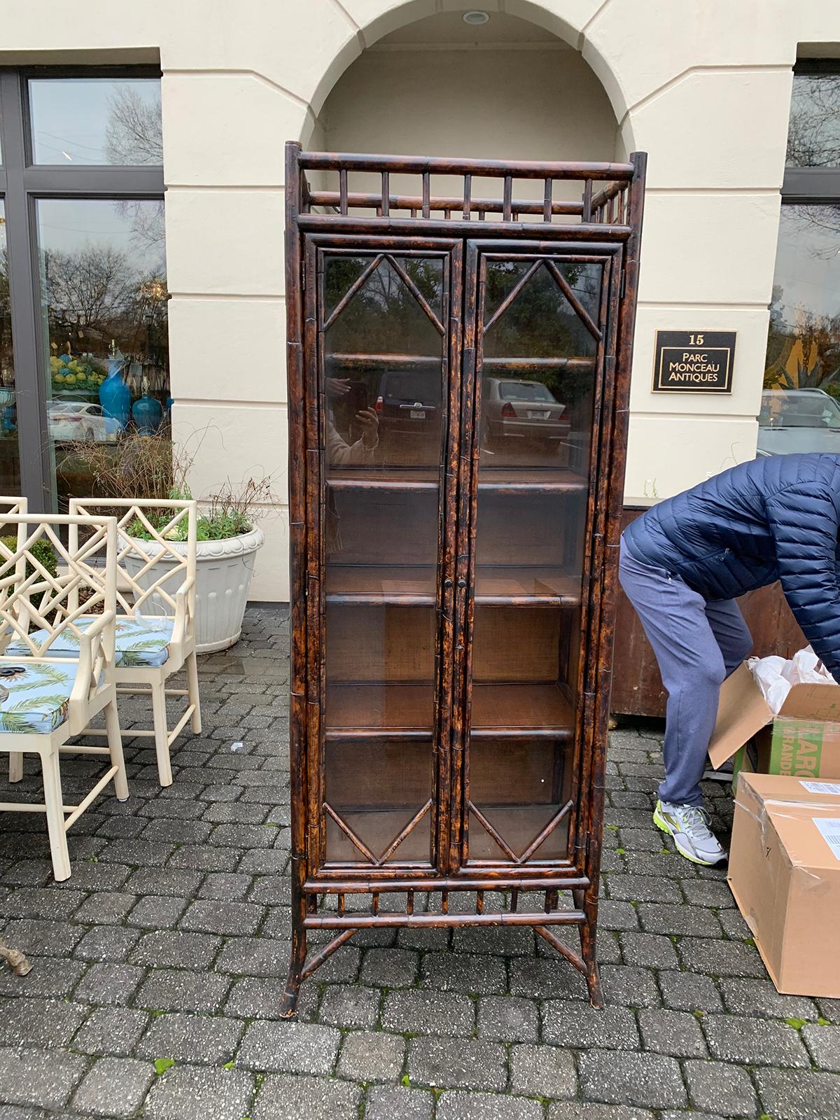 19th-20th century English tall bamboo cabinet or Bibliotheque with glass doors.