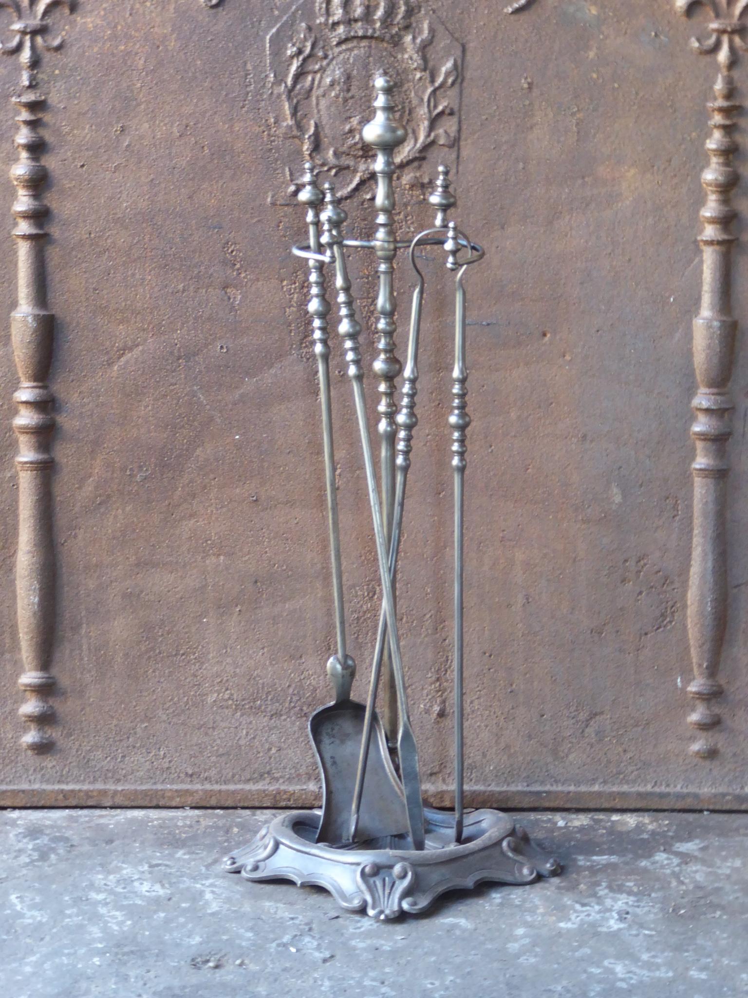 19th century Napoleon III fireplace toolset made of cast iron and wrought iron. The toolset is in a good condition and is fully functional.







