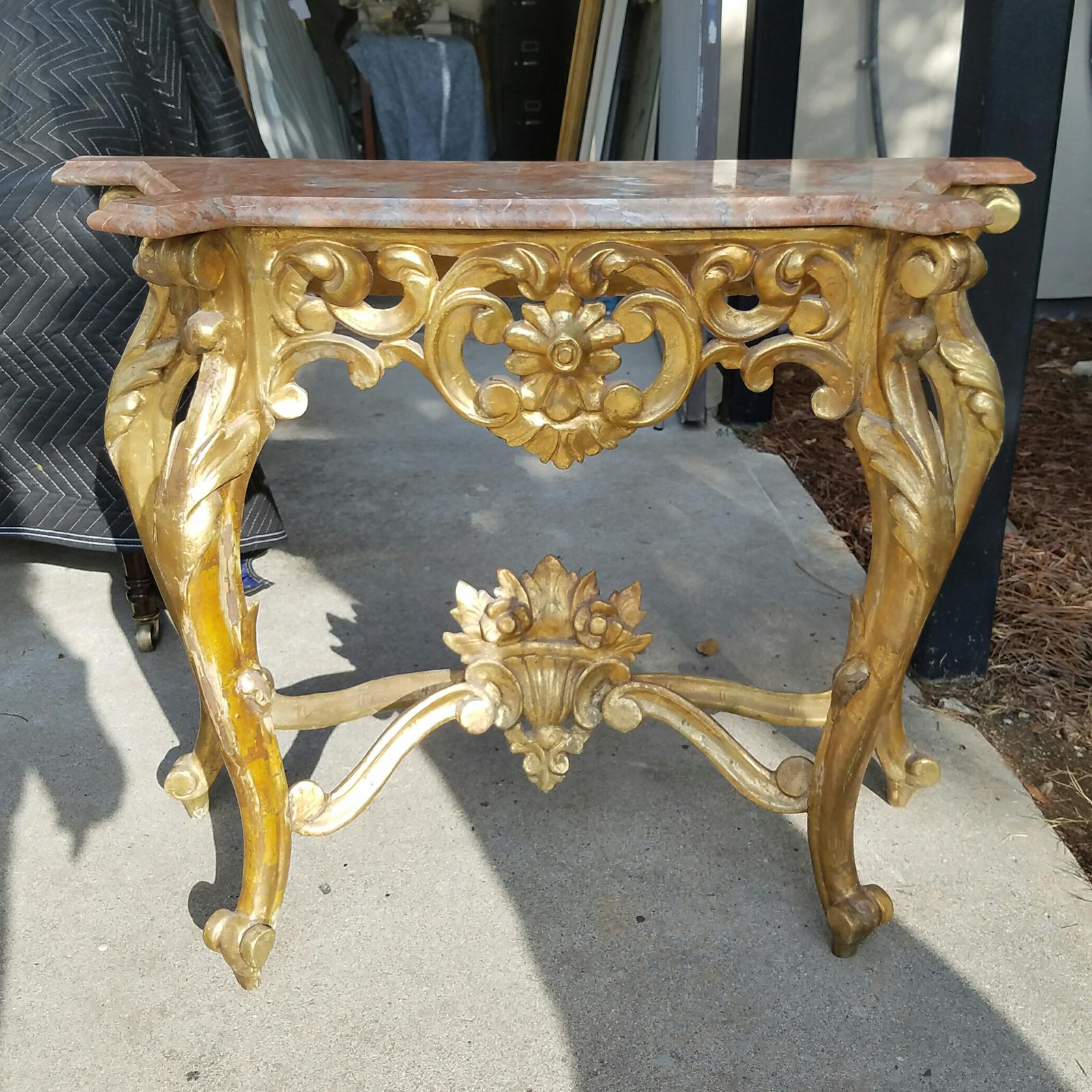 19th-20th century French carved giltwood console with marble top.