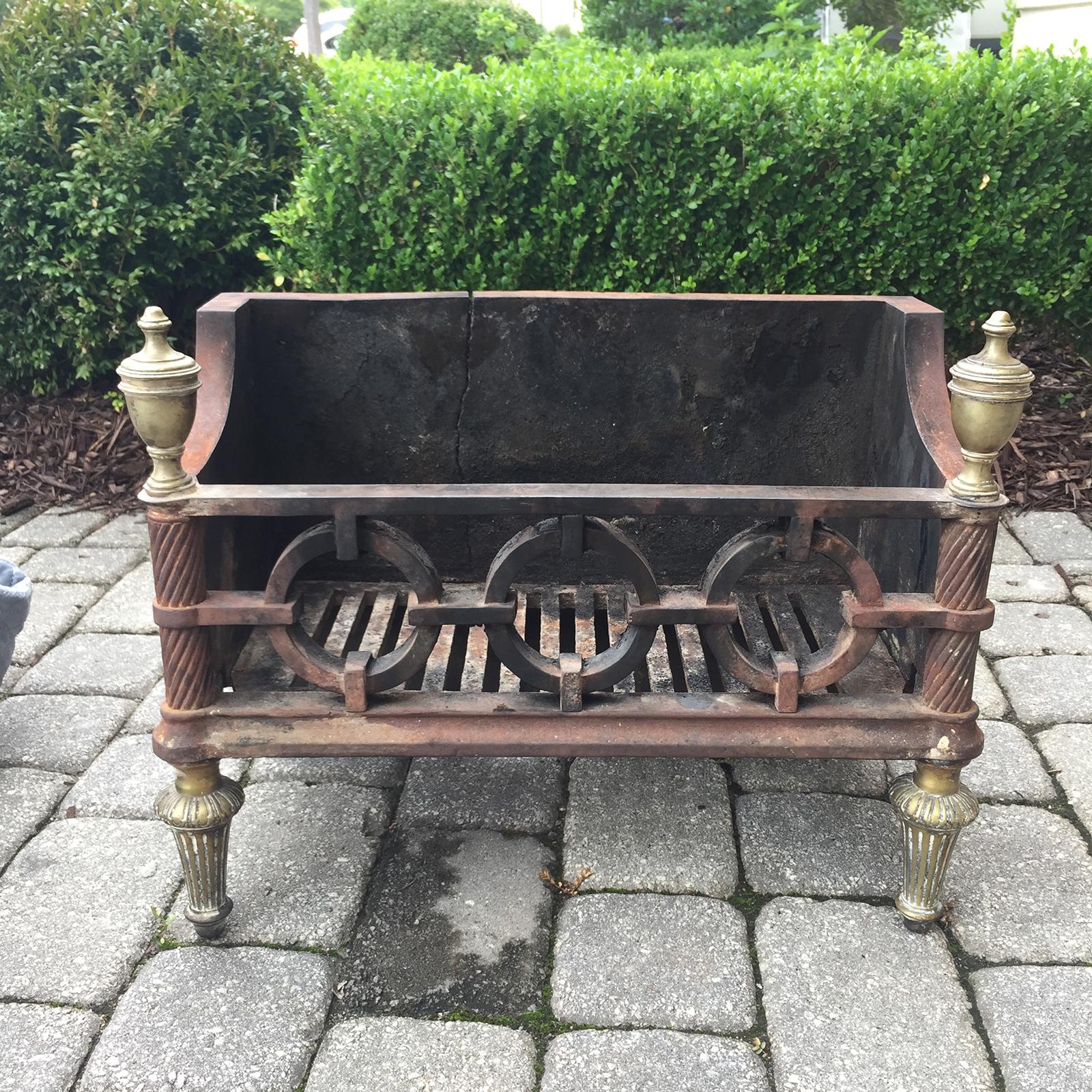 19th-20th century George III style cast iron and brass fire grate.