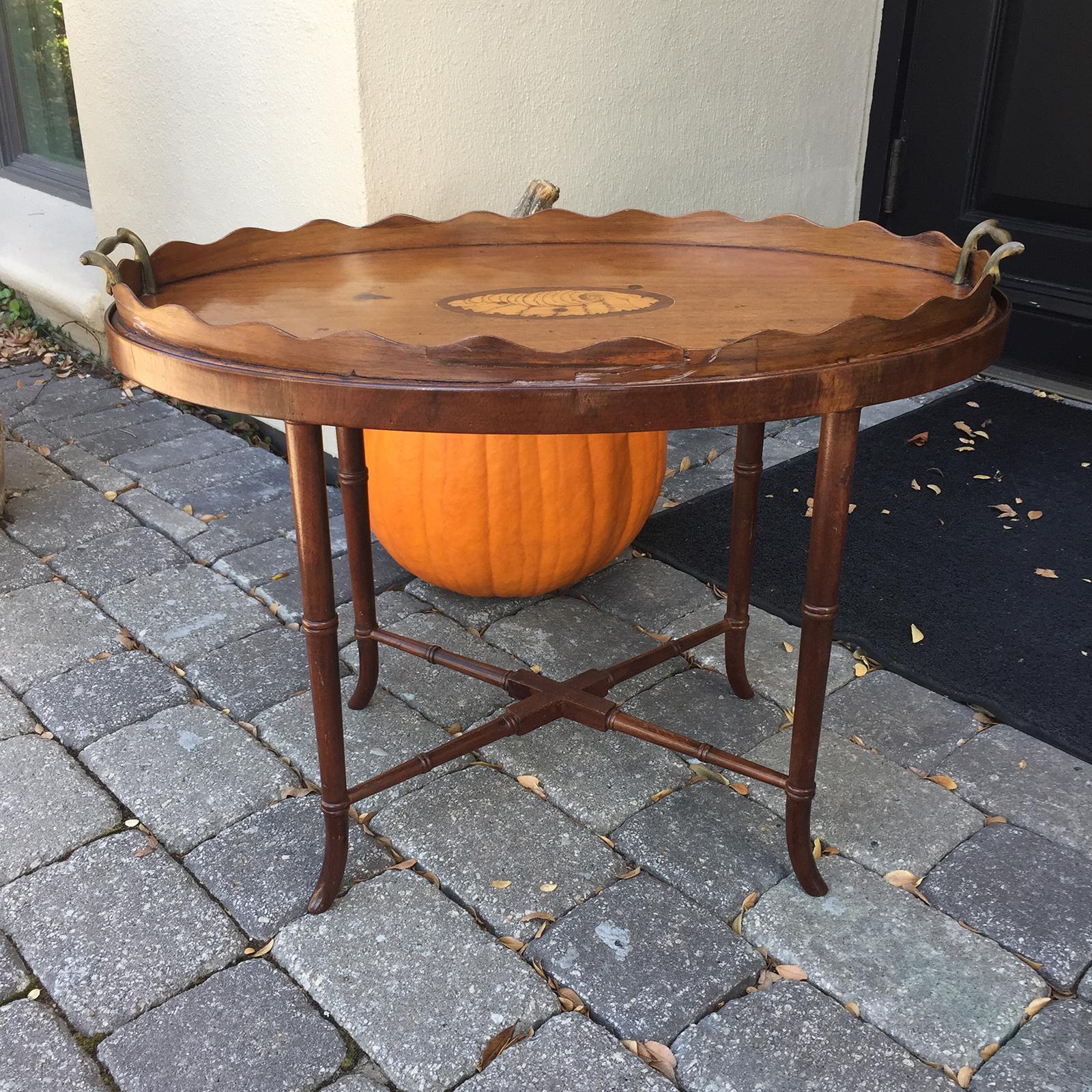 19th-20th century Georgian style tray table on stand with inlaid shell motif.