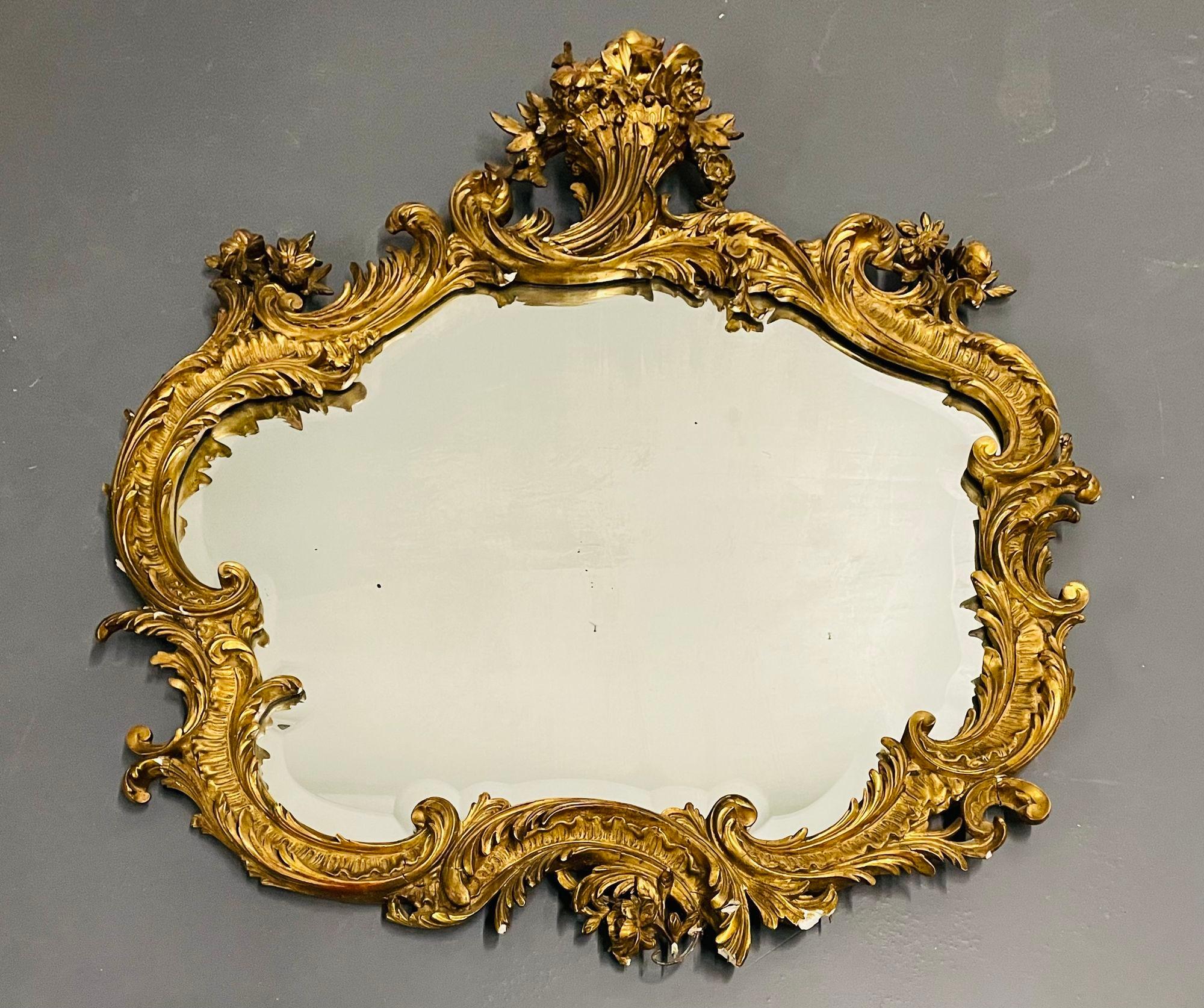 19th or 20th century giltwood French mirror, wall or console, floral decorated
A stunning floral basket gilt gesso wall or console mirror having a thick beveled mirror framed in a gilt wood and gesso scroll, floral, basket and leaf design frame. In