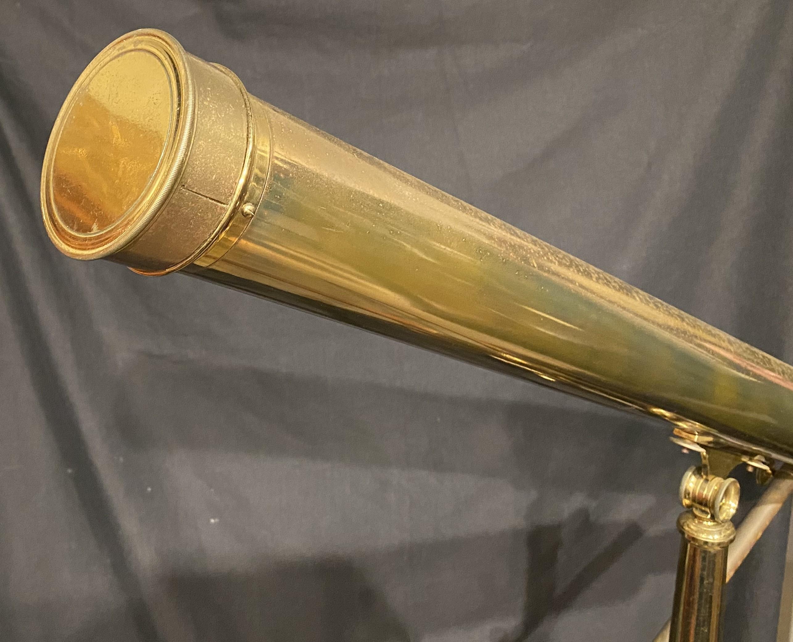 A nice example of a large brass telescope or spyglass on brass & wooden tripod, signed “Hammersley London,” circa late 19th or early 20th century, in very good condition, with some surface pitting on the brass surfaces, and light wear commensurate