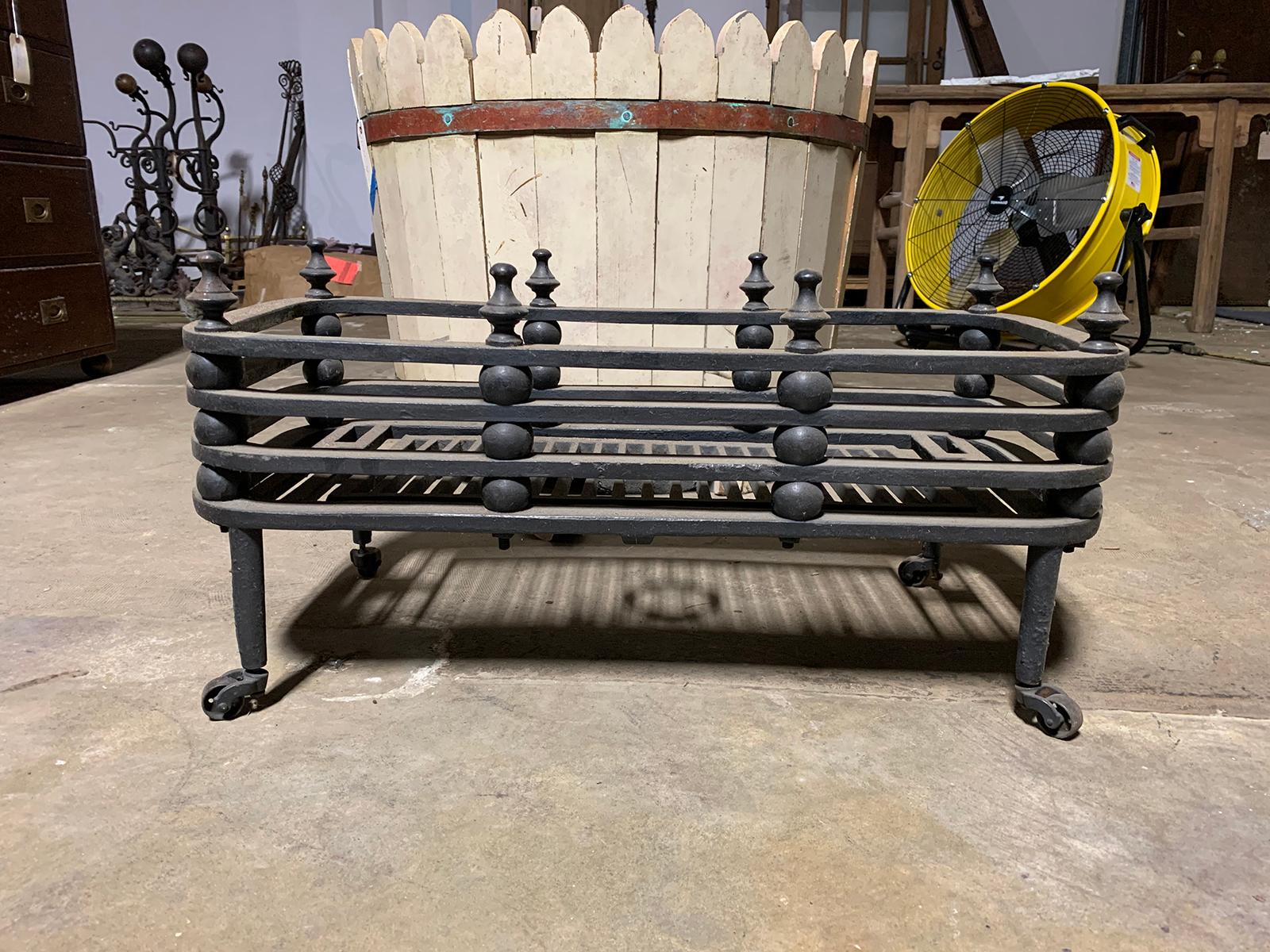 19th-20th century iron fireplace grate
Measures: 27.75