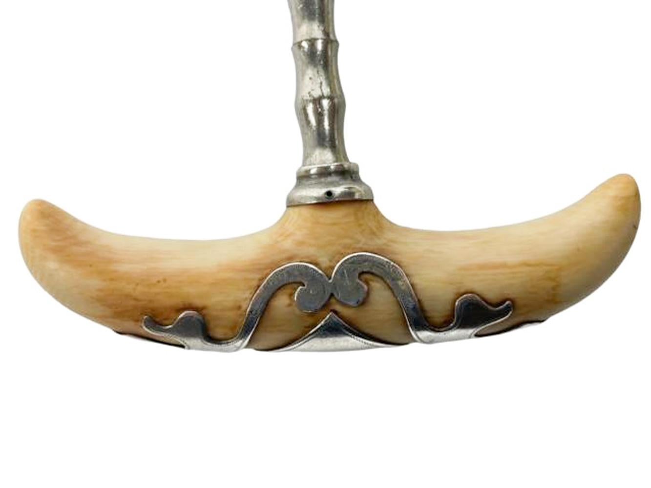 19th / 20th century corkscrew with cupids bow carved ivory handle with sterling silver overlay.