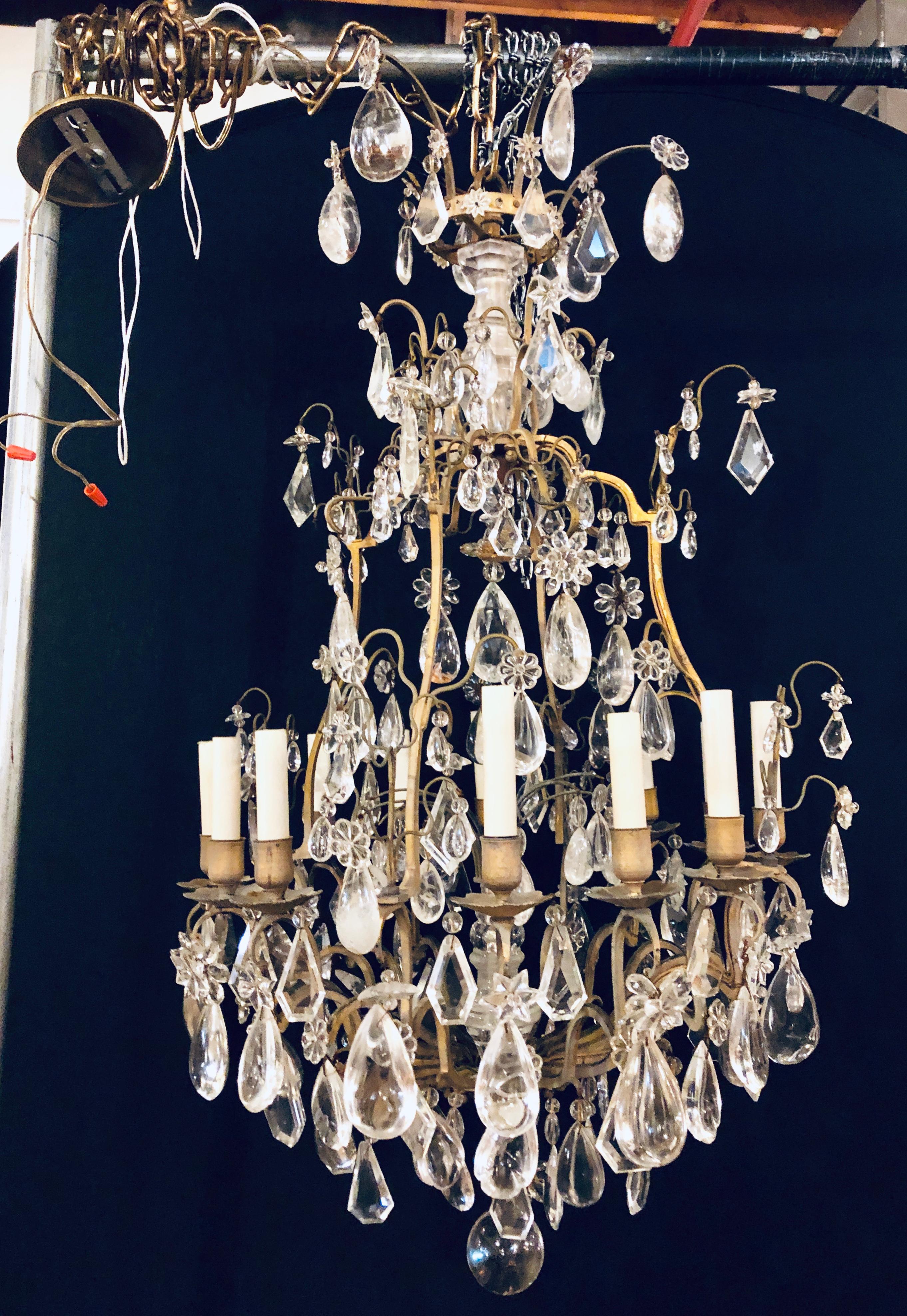 Fine 19th-20th century Louis XVI style 12 light bronze and rock crystal chandelier. Spectacular in a word. This Fine chandelier has recently been removed from a New Cannan Ct Mansion. The bronze frame having one dozen lights with two rock crystal