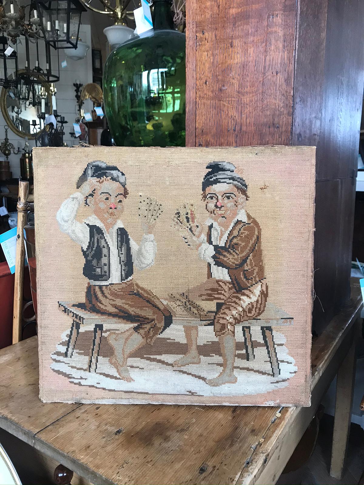 19th-20th century needlepoint of card players, mounted to wood frame.