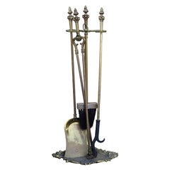 19th-20th Century Neoclassical Brass Four-Piece Fire Tool Set with Flame Finials