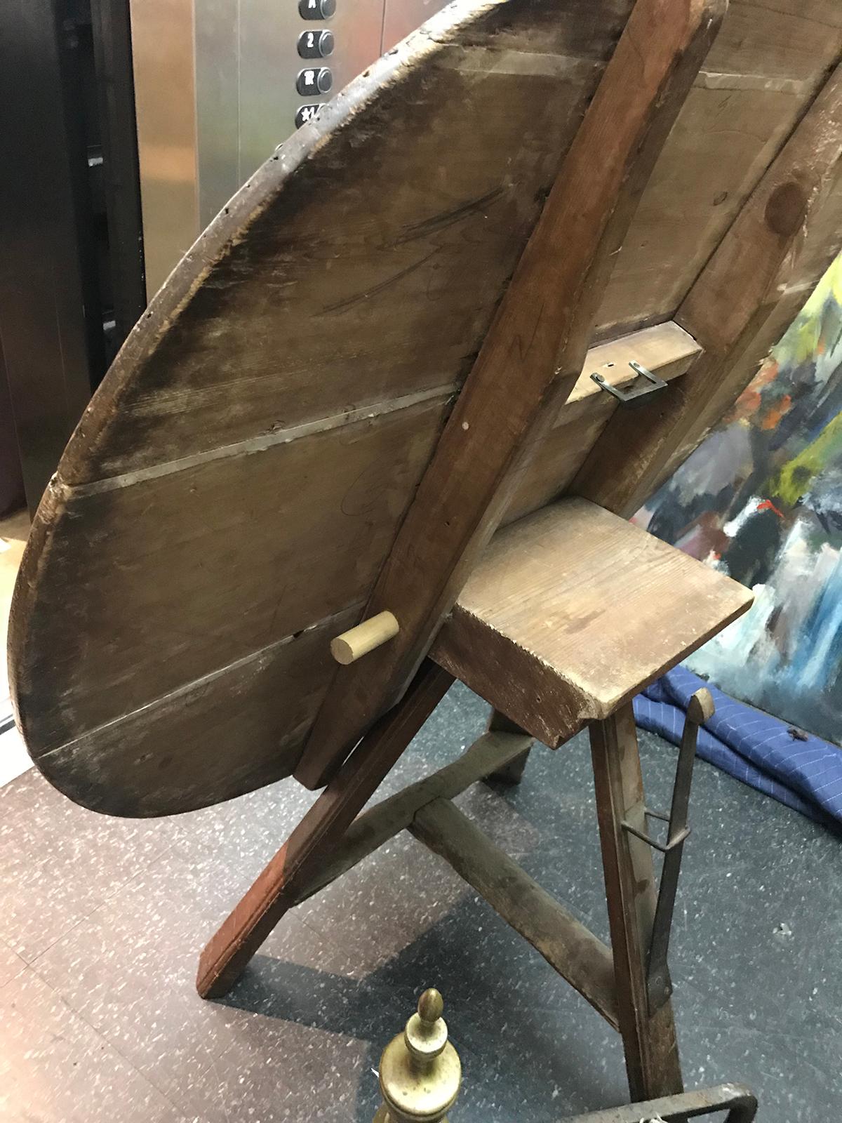 19th-20th century old round tilt-top work table with great patina.