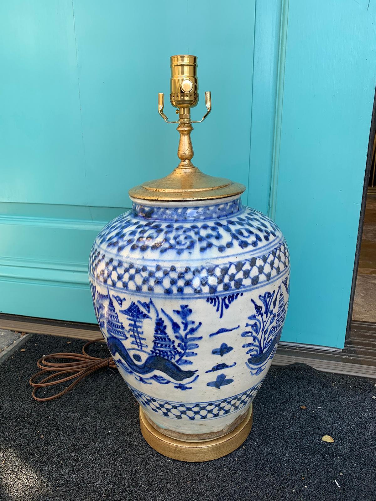 19th-20th Century blue and white salt glazed porcelain lamp on custom giltwood base.