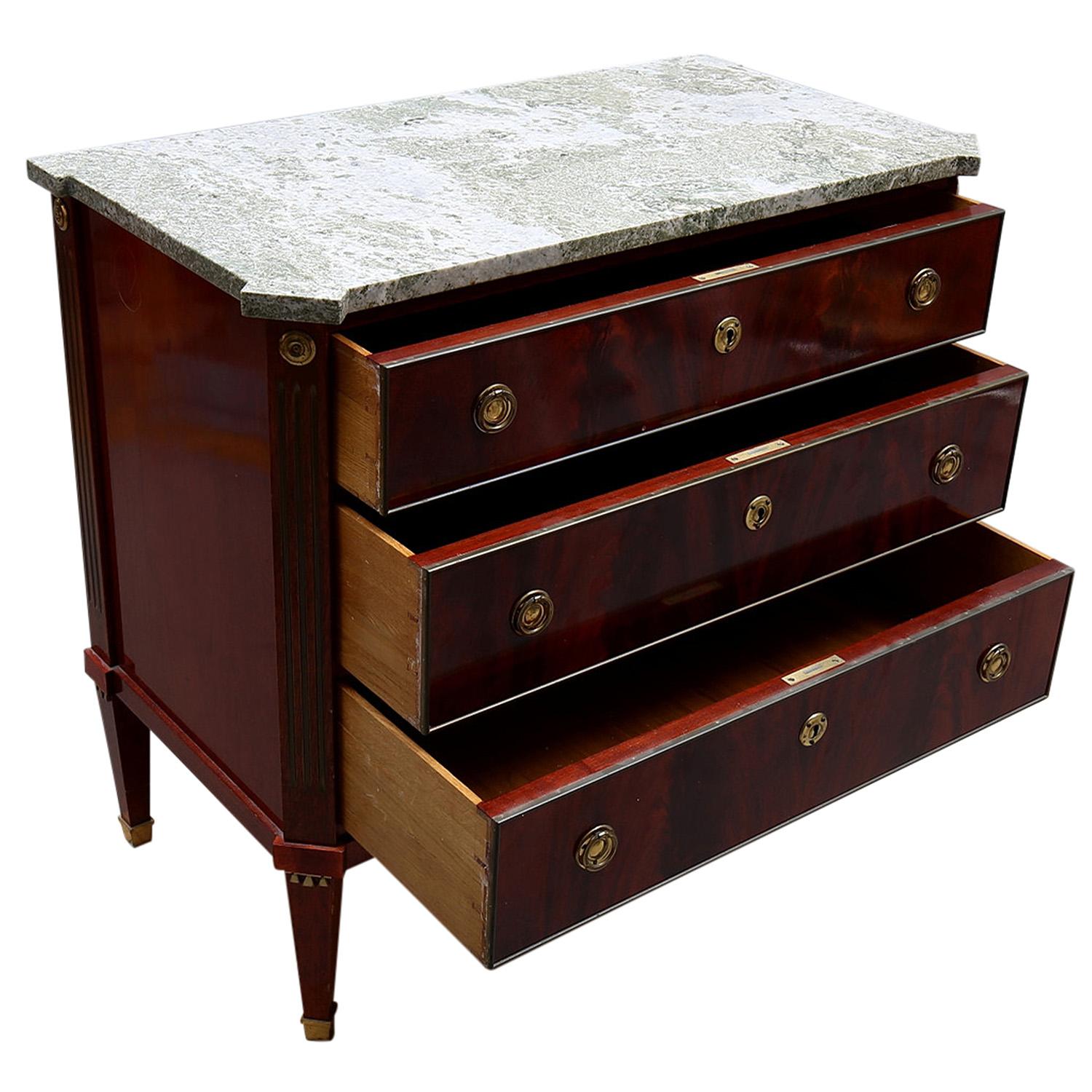 A late 19th Century, antique Swedish Gustavian chest, commode with three drawers made of hand crafted polished, partly veneered Mahogany, in good condition. The rectangular Scandinavian cabinet is composed with a light-grey, white stone slab,