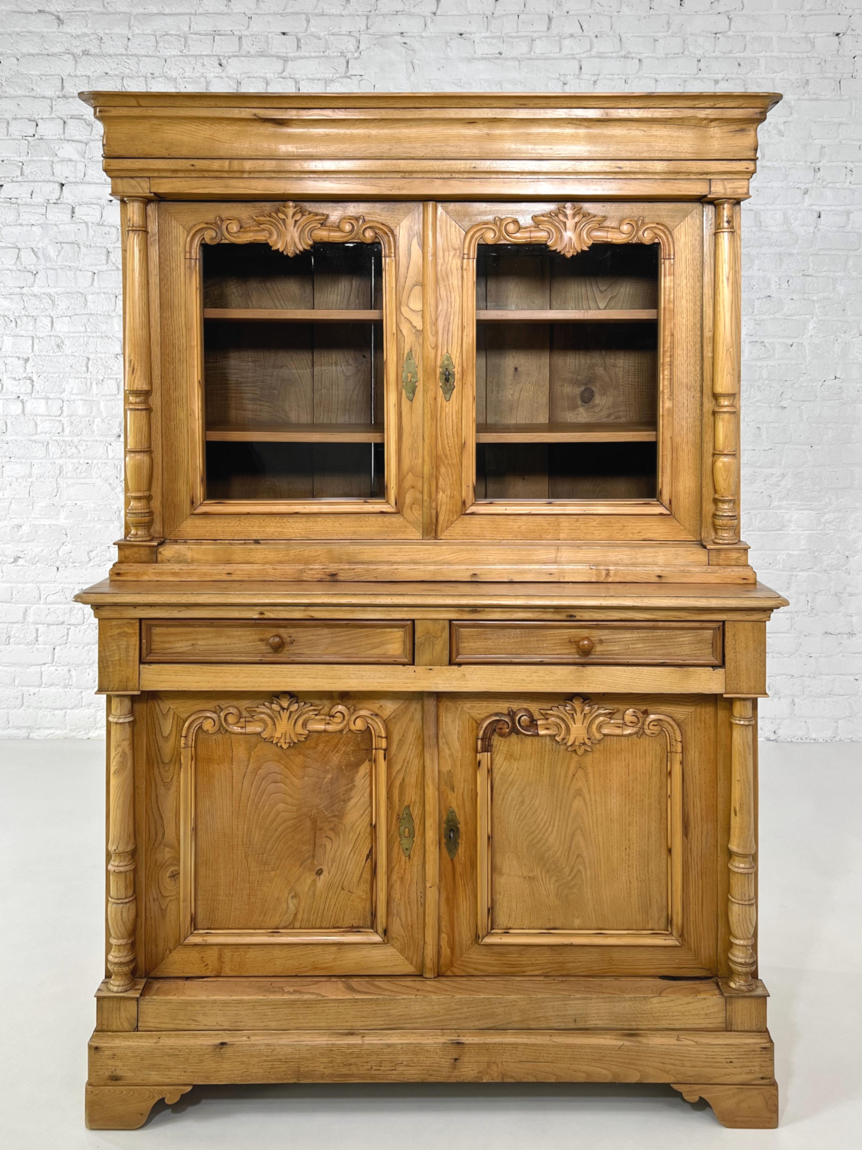 19th-20th French Antic Pine Wood and Glass Armoire or Vitrine Cabinet composed of 2 parts:

Up one with vitrine storage spaces, 2 graphic glass panel doors with fine sculpted finishes, opening on wooden shelves 
Bottom one with closed spaces,