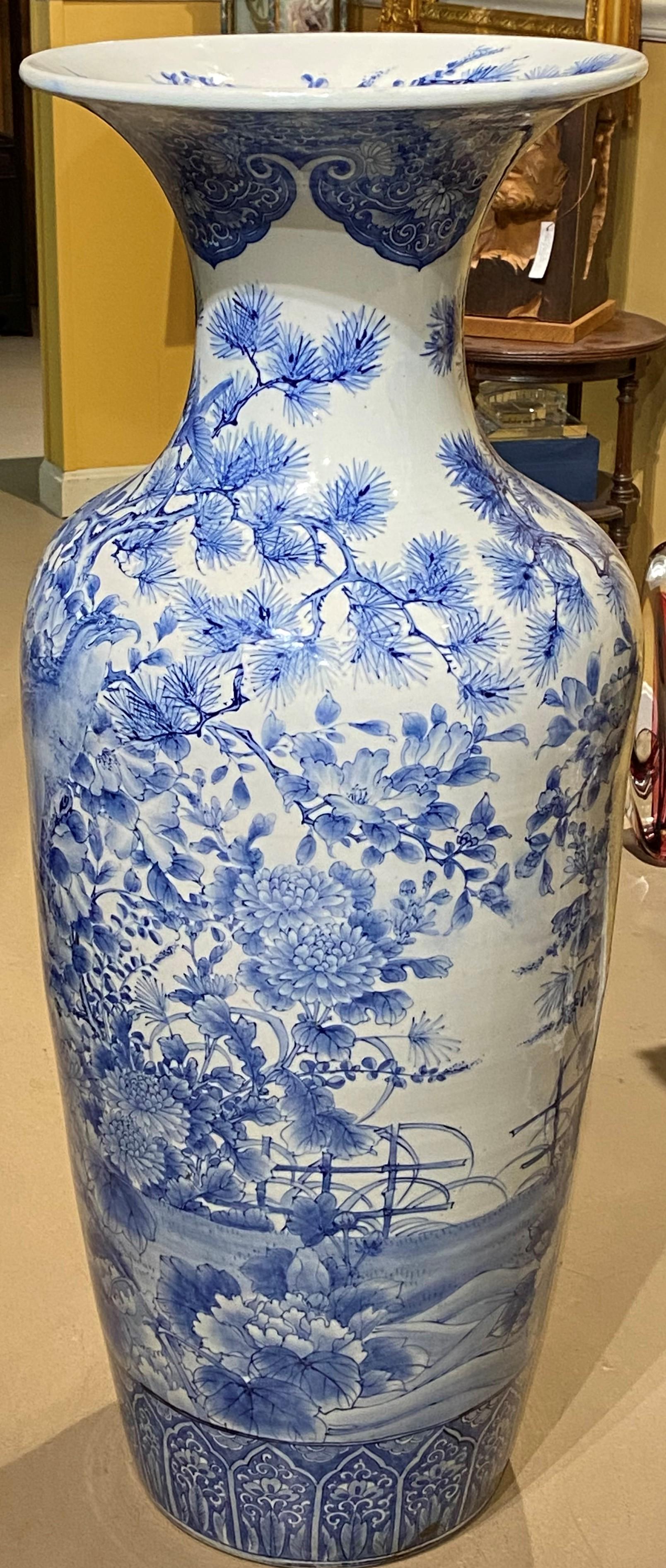 A beautiful example of a large blue & white porcelain baluster form floor vase with flared rim, adorned with bird and foliate decoration, including the inside of the rim. Japanese in origin, probably dating to the late 19th or early 20th century, in