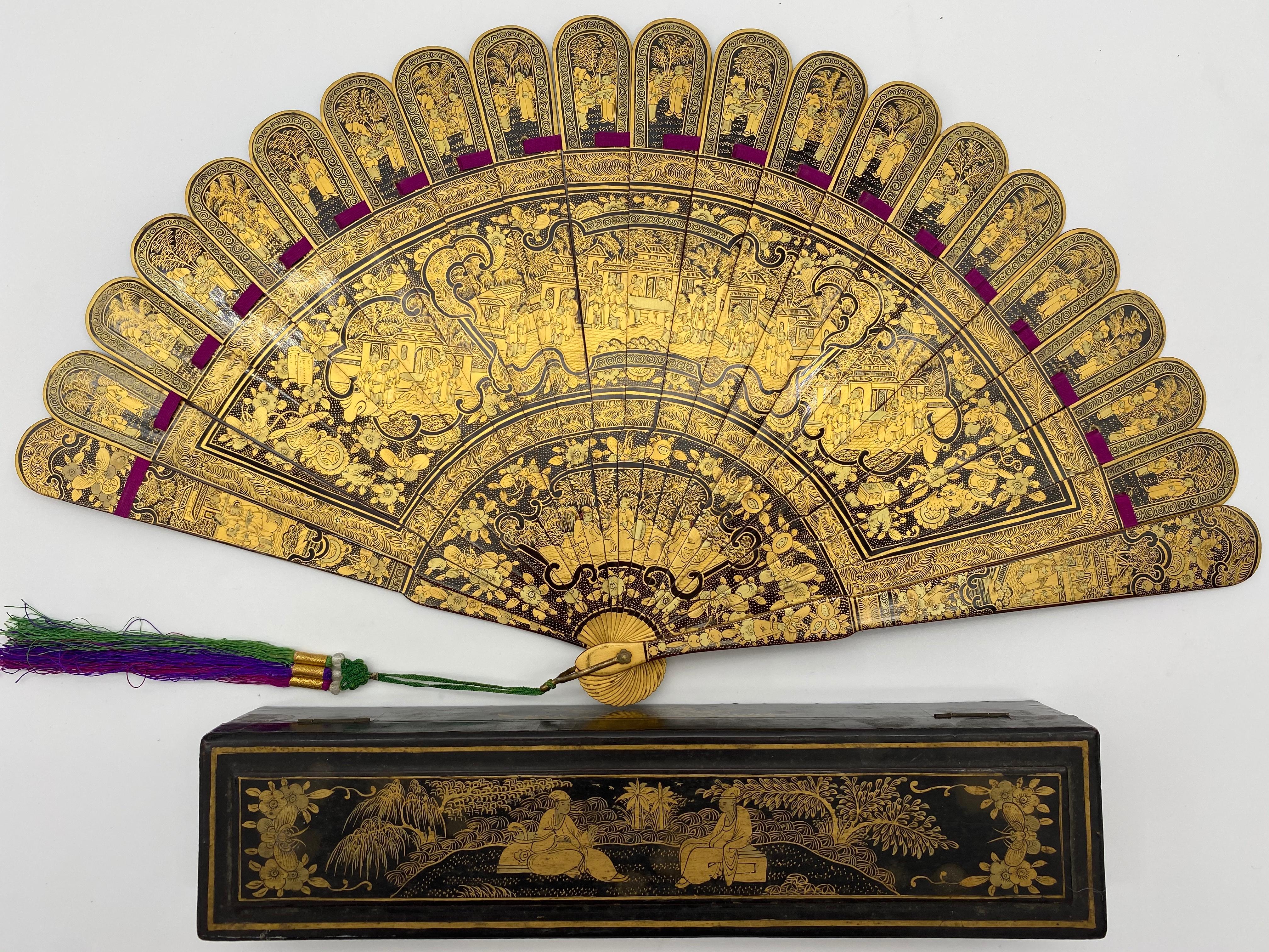 19th century antique Chinese hand painted gold lacquer scene gilt fan 100 faces with original lacquer box, fan is 17 inch x 9.5 x 1, the lacquer fan box is 10.5 x 2.5 x 2 inch.