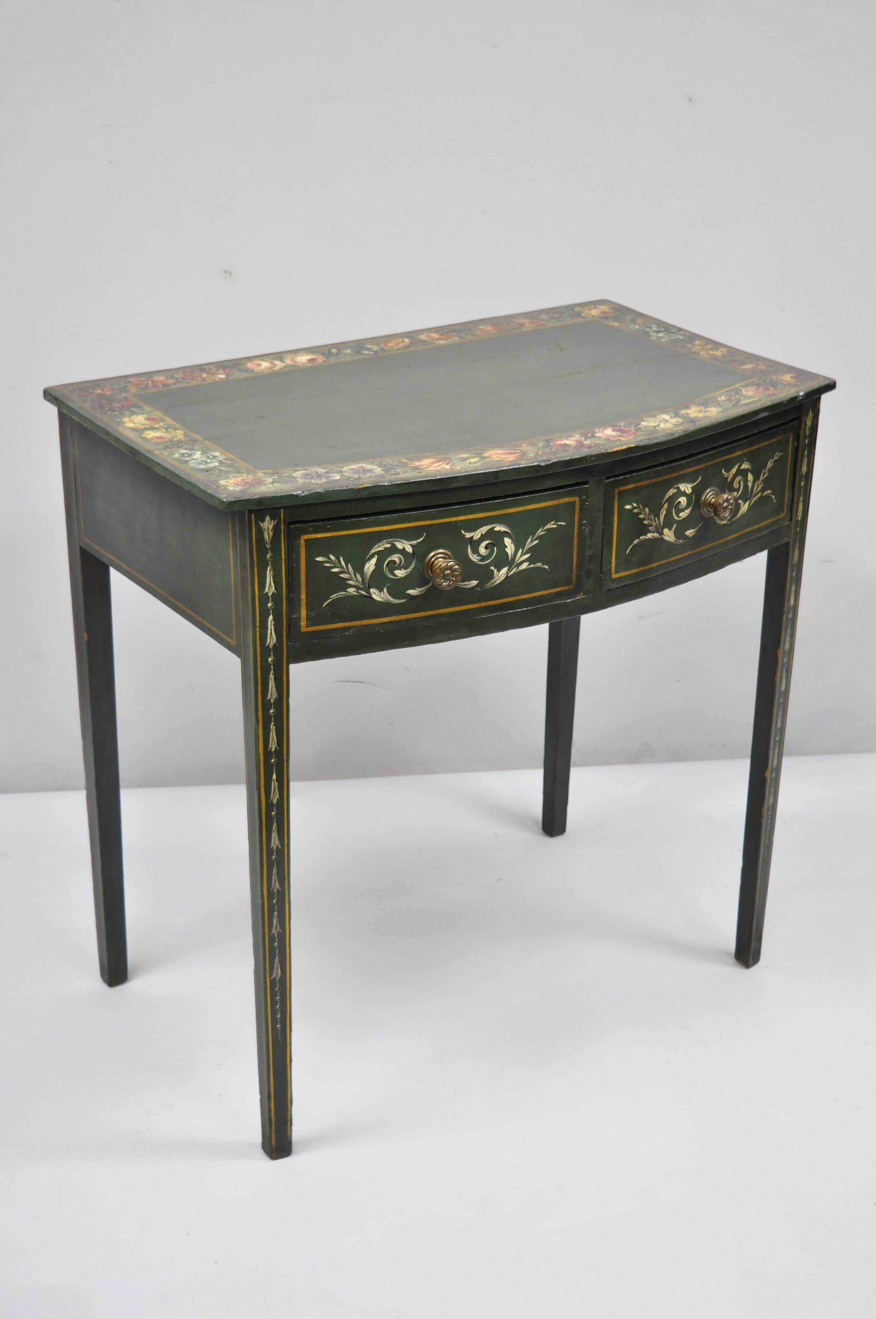 19th century antique green flower painted Victorian 2-drawer demilune hall console table. Item features hand painted floral scrollwork, bellflowers, colorful floral painted top, green painted finish, shaped demilune top, solid wood construction, 2