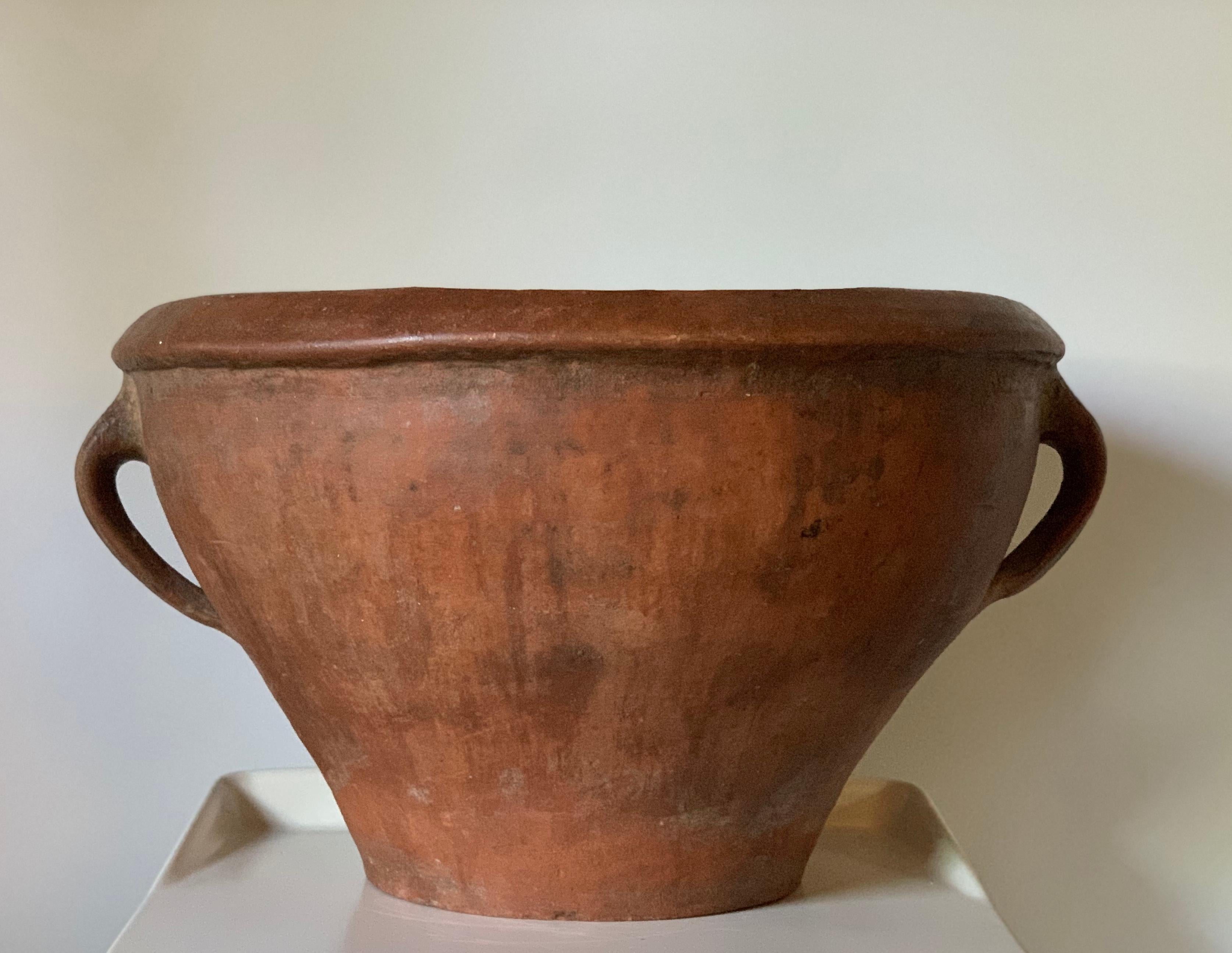 19th century Spanish ceramic olla - pot. Earth tone glaze, two handles and applied molding. In very good shape for its age. Originally used for water and cooking. Can be used for planting. Lovely original patina.