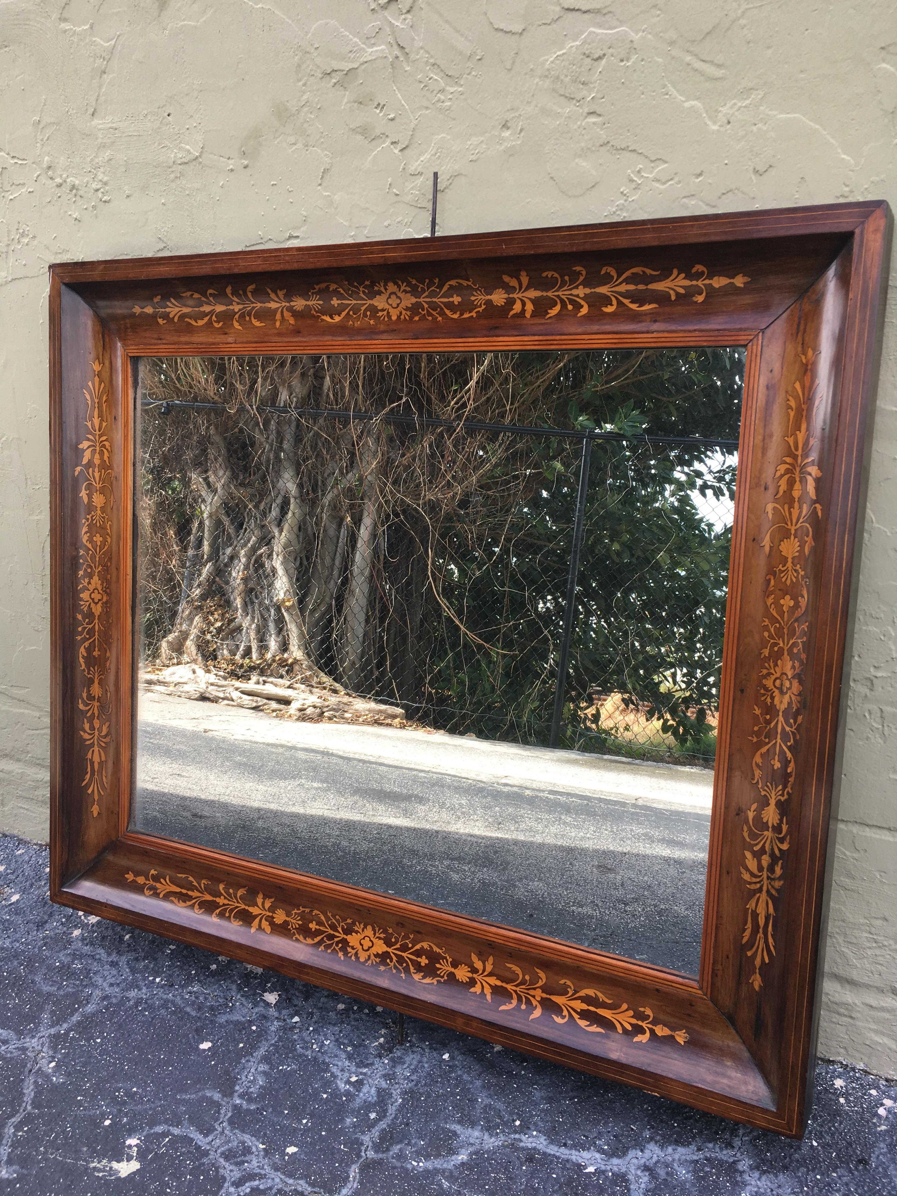 About
This is a beautiful antique Spanish flame mahogany and marquetry wall mirror, circa 1840 .

The mahogany frame is beautifully inlaid with a continuous marquetry border.

The quality and craftsmanship of this stunning piece is absolutely