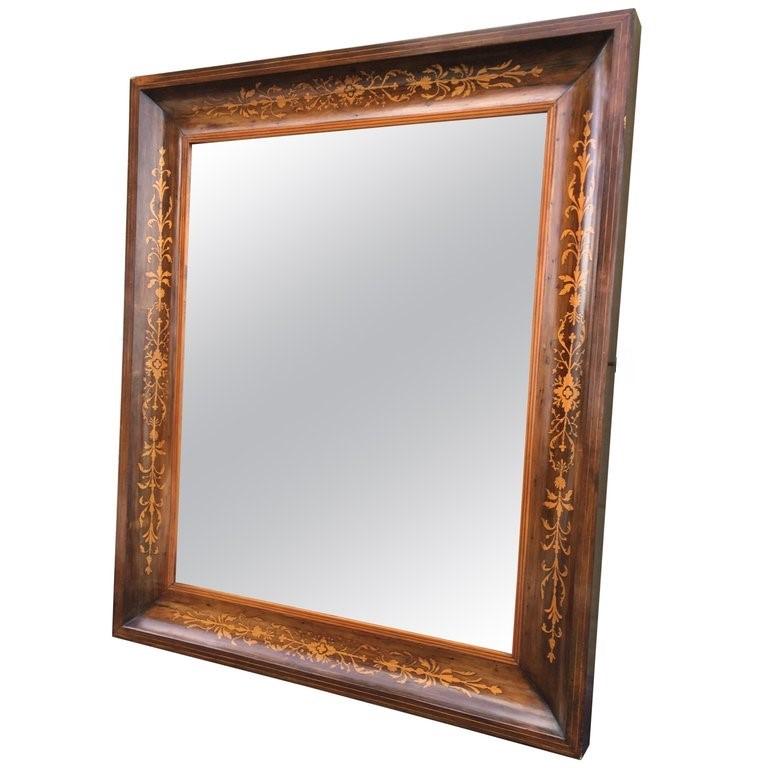 About
This is a beautiful antique Spanish flame mahogany and marquetry wall mirror, circa 1840.

The mahogany frame is beautifully inlaid with a continuous marquetry border.

The quality and craftsmanship of this stunning piece is absolutely