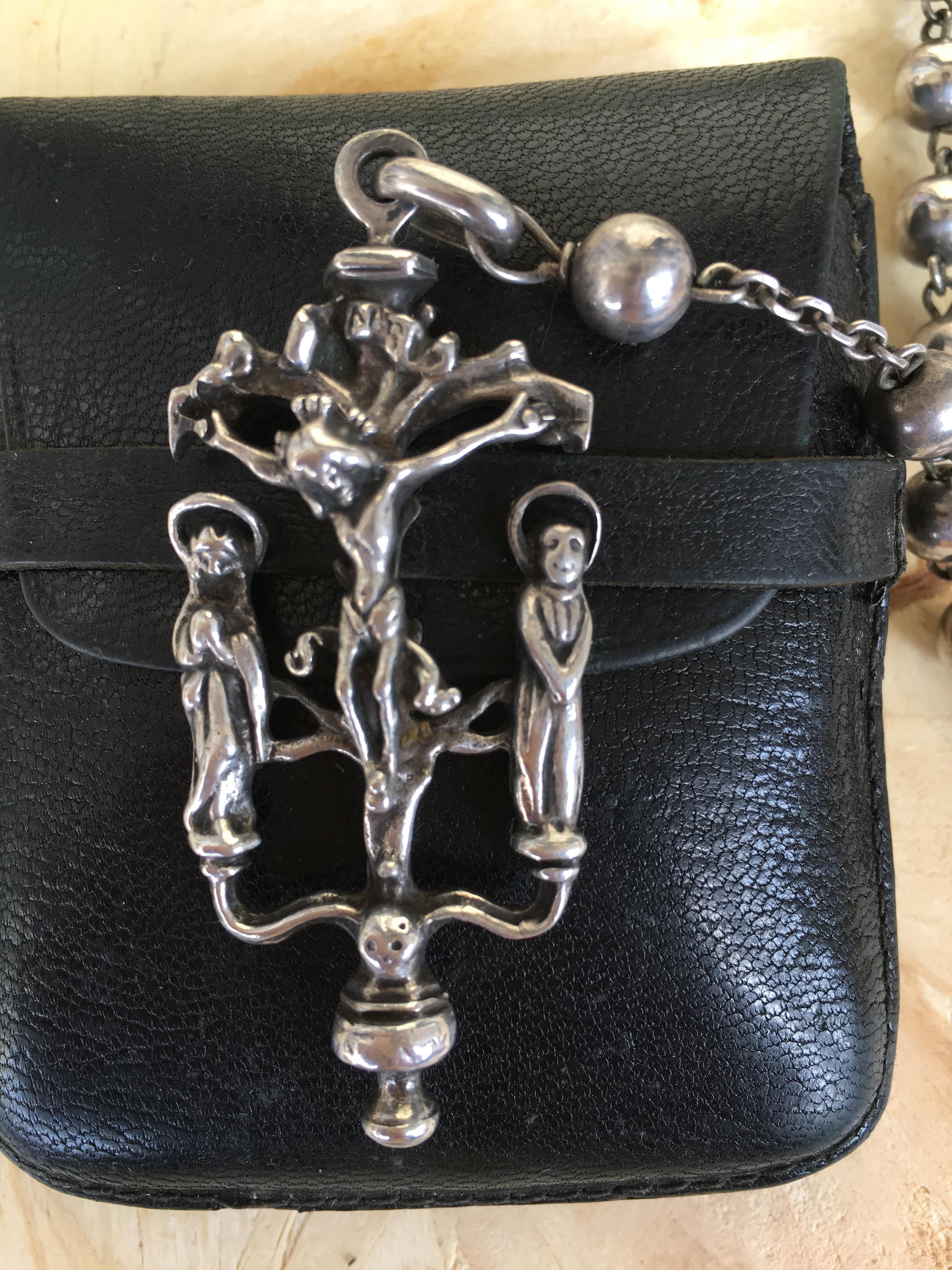 19th antique silver rosary with two religious scenes.