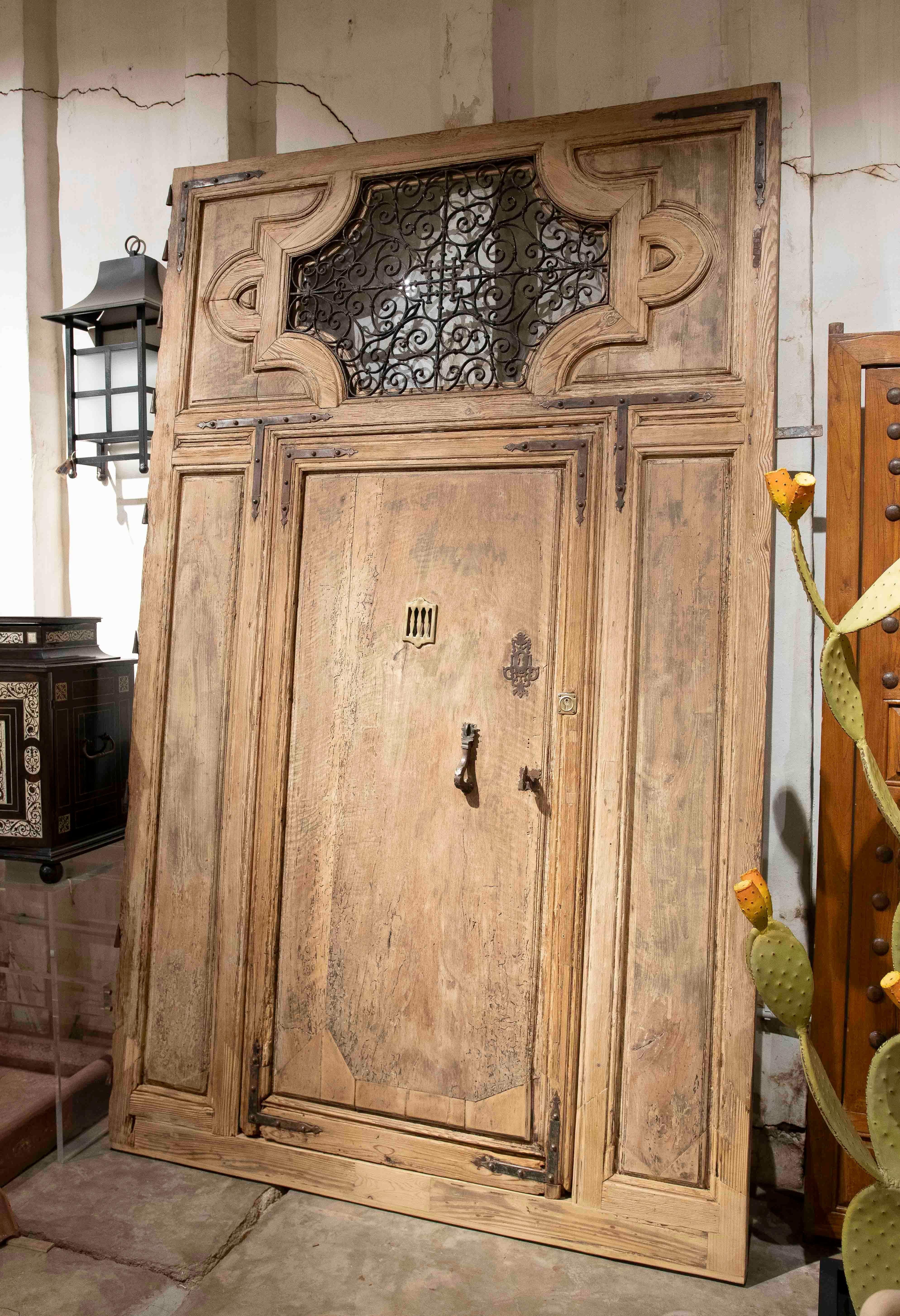 19th Antique Wooden Entrance Door with Wrought Iron Grille and Bronze Knockers In Good Condition For Sale In Marbella, ES