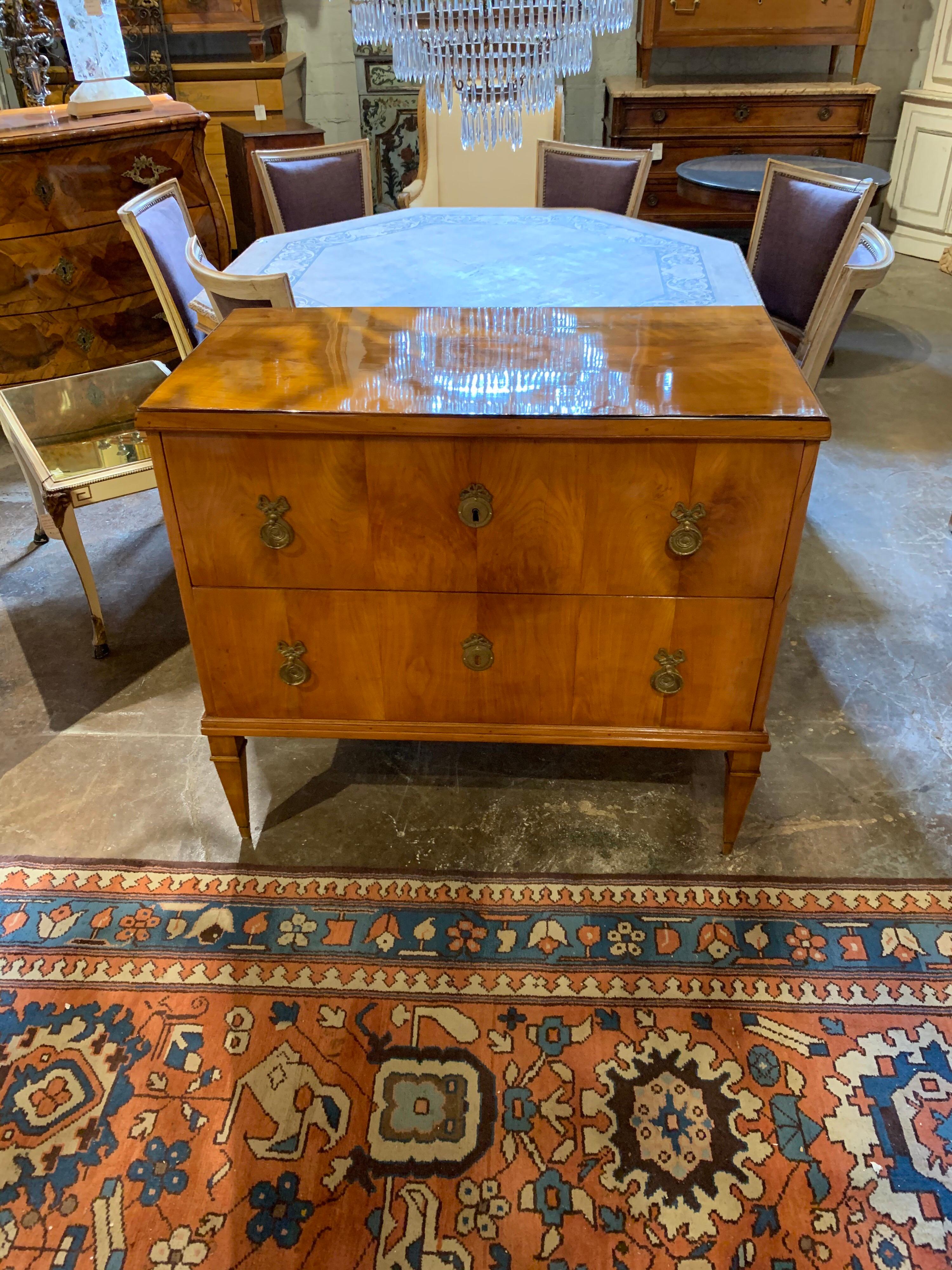 Exceptional 19th century Austrian Biedermeier walnut commode with nice brass hardware. Beautiful finish and nice clean lines. A lovely Classic style!