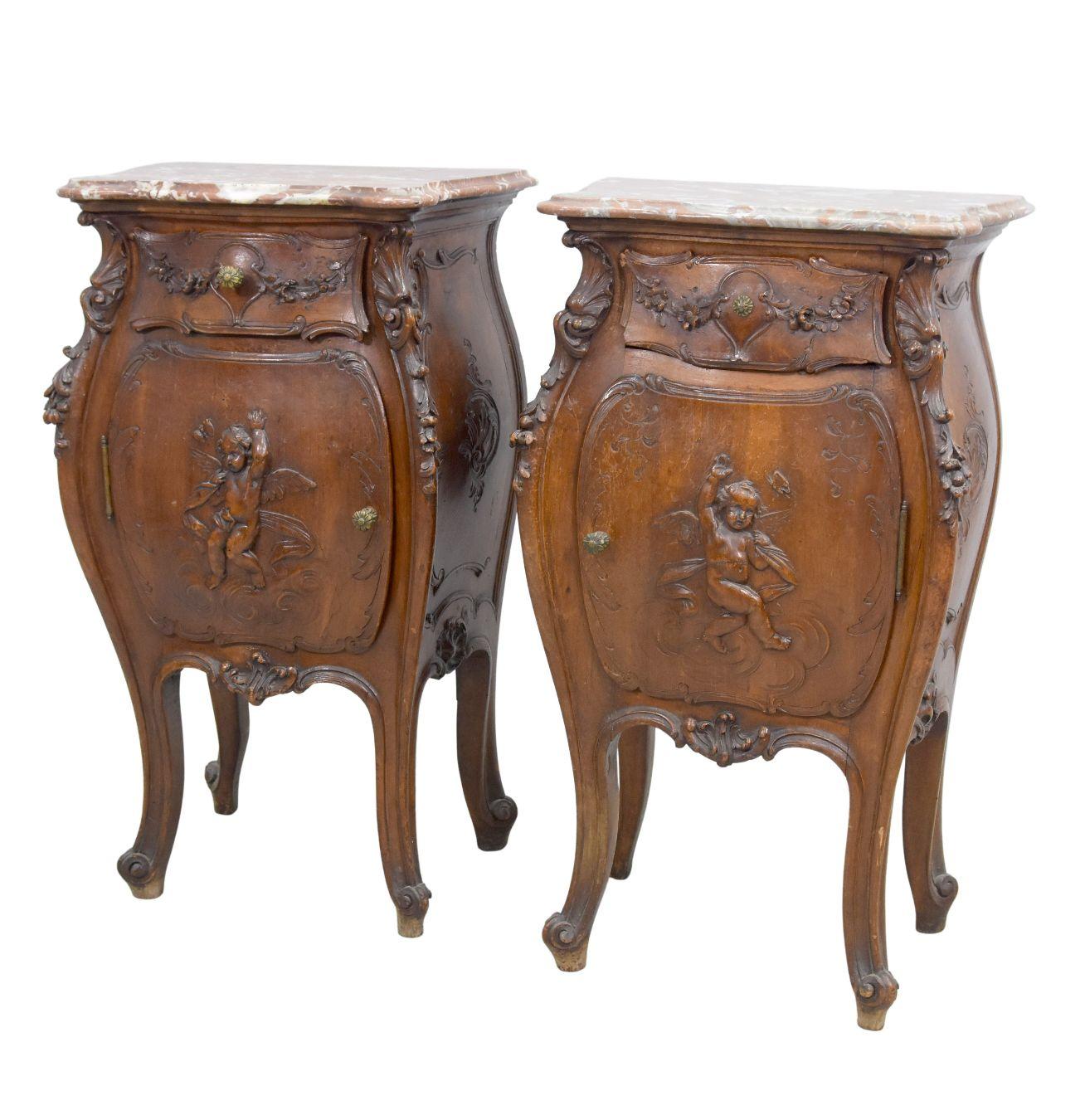 19th Pair of Louis XV style walnut bedside tables with putti decor richly carved with babies red marble top dimension. Part of a set including a wardrobe a bed, a dressing table.